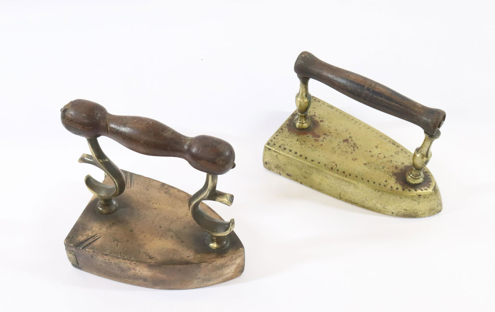 (2) EARLY BRASS SLUG IRONS (1 of 4)