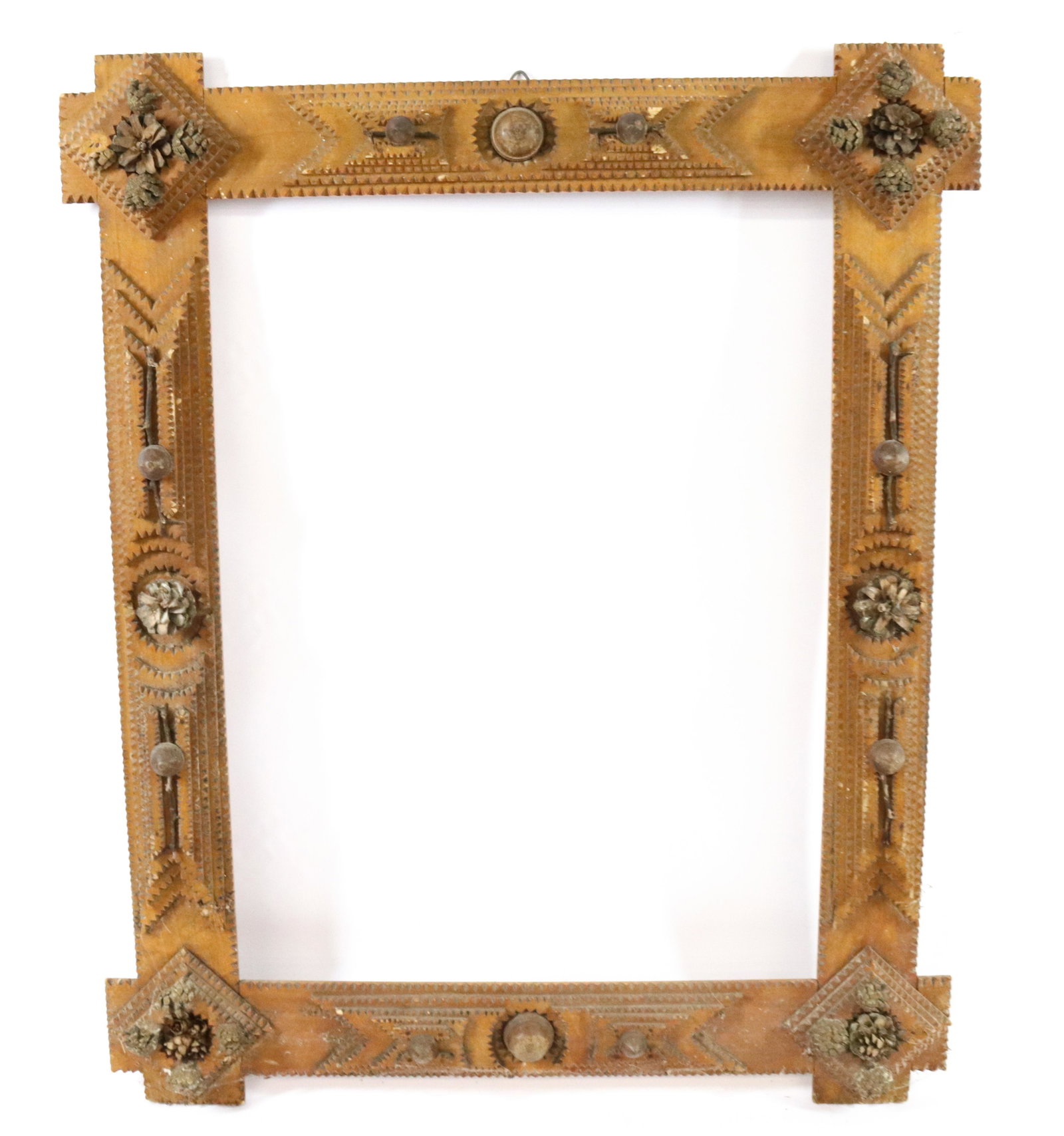 TRAMP ART FRAME: CHIP CARVED FRAME WITH APPLIED PINECONES AND ACORNS - 5 LAYERS WITH GEOMETRIC DESIGN Size: INTERIOR 15" X 20" - OVERALL 27" X 22" Terms: Hartzell's Auction Gallery will handle most of the shipping in-
