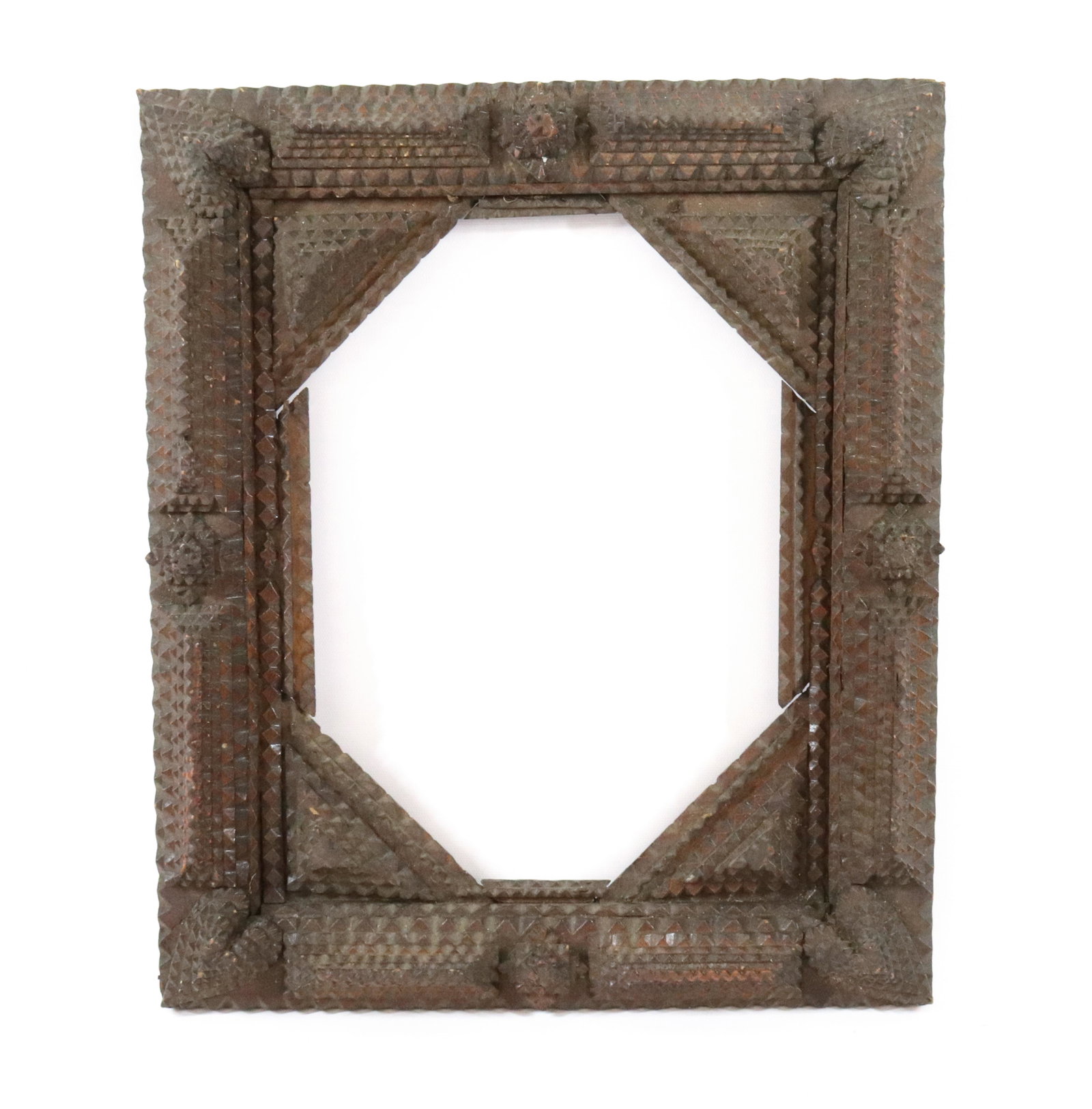 TRAMP ART FRAME: (6) CHIP CARVED LAYERS WITH HEART CORNER MOTIF Size: 8 1/2" X 13" INTERIOR AND 17 1/2" X 15" OVERALL Terms: Hartzell's Auction Gallery will handle most of the shipping in-house. WE do reserve the righ