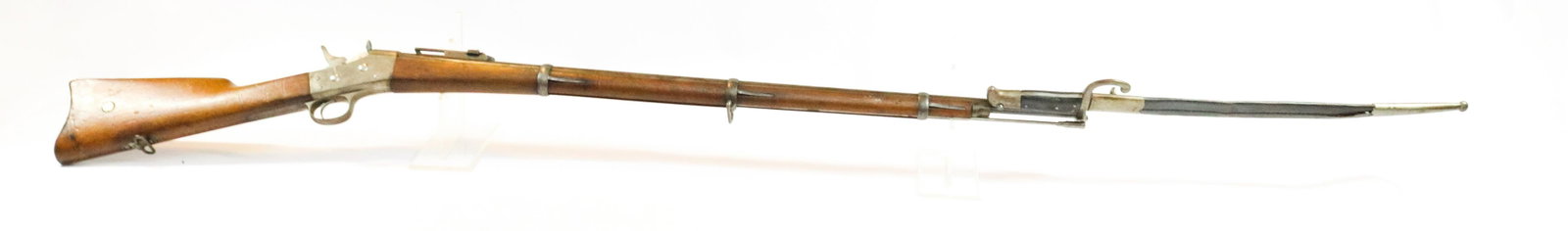 REMINGTON MODEL 1867 ROLLING BLOCK RIFLE: 12.17MM - SERIAL# 59224 - ROYAL CROWN PROOF MARK ON FRAME - 1881 NORWAY/SWEDISH -WITH SOLINGEN BAYONET AND SCABBARD Size: 34" BARREL Terms: Hartzell’s Auction Gallery will handle all Background 