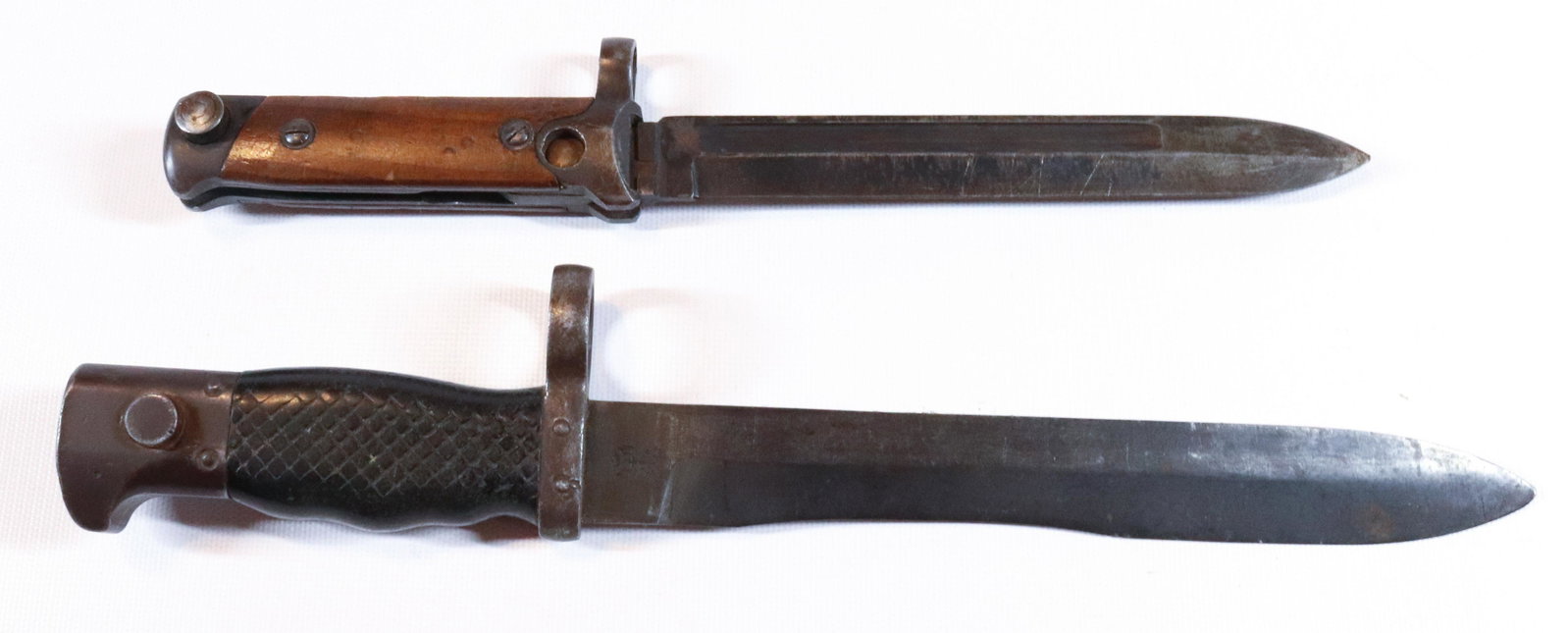 (2) MILITARY BAYONETS: BOTH ARE UNMARKED Terms: Hartzell’s Auction Gallery will handle all Background Checks On-Site. Sunday April 3rd from 9:00am till 2:00pm or Monday April 4th from 9:00am till 3:00pm or by appointm