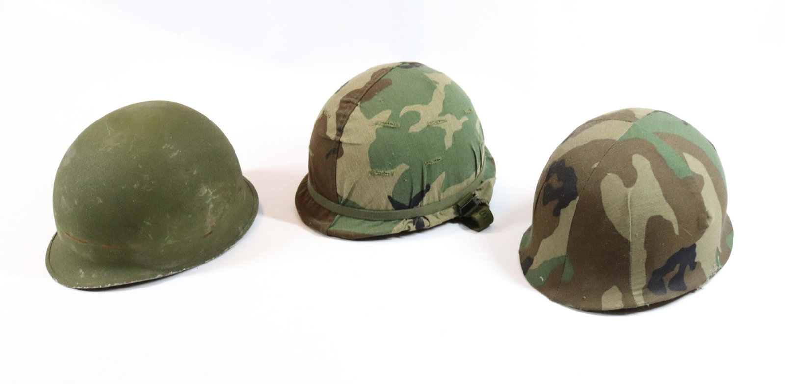 LOT OF MILITARY HELMETS: (3) ARMY STYLE HELMETS, (2) WITH LINERS Size: 8" INTERIOR MEASUREMENTS Terms: Hartzell’s Auction Gallery will handle all Background Checks On-Site. Sunday April 3rd from 9:00am till 2:00pm or Mo