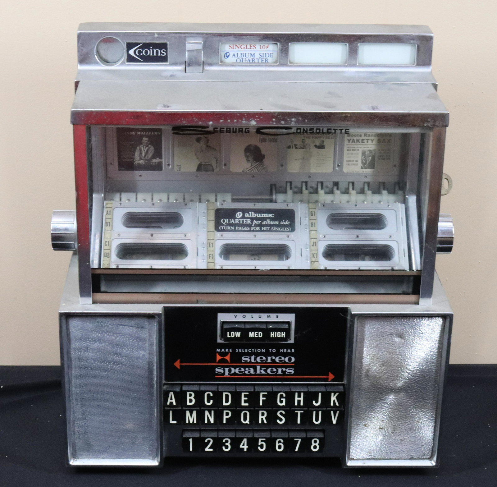 VINTAGE DINER JUKEBOX: SEEBURG CONSOLETTE - WITH KEY Size: 15" X 13" X 7" Terms: This is an On-Site Auction. Pick-up will be from Monday April 4th – Thursday April 7th from 9:00am till 4:00pm OR BY APPOINTMENT. All It