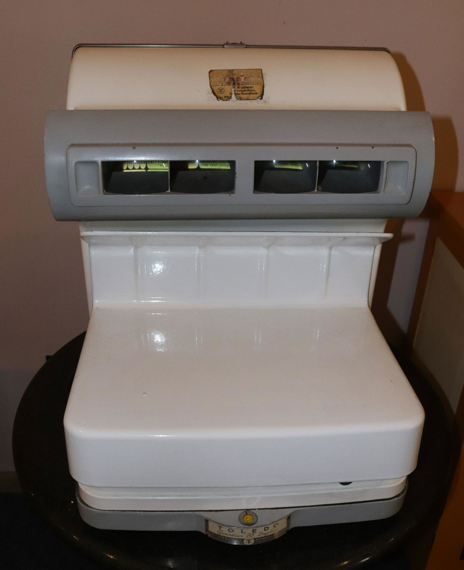 VINTAGE TOLEDO SCALE: WHITE PORCELAIN BODY. LIGHT-UP FACE Size: 20 1/2" X 18" X 18" Terms: This is an On-Site Auction. Pick-up will be from Monday April 4th – Thursday April 7th from 9:00am till 4:00pm OR BY APPOINTM