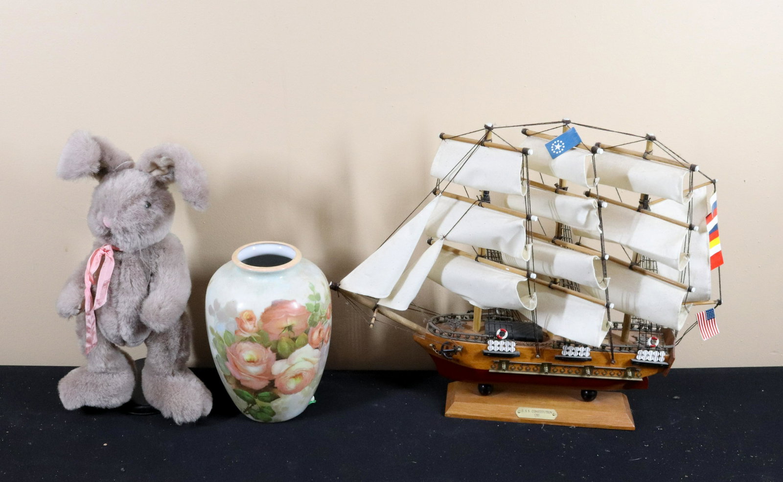 MODEL BOAT, PLUSH RABBIT AND VASE: REPLICA OF USS CONSTITUTION Size: SHIP 14" H Terms: This is an On-Site Auction. Pick-up will be from Monday April 4th – Thursday April 7th from 9:00am till 4:00pm OR BY APPOINTMENT. All Items mu