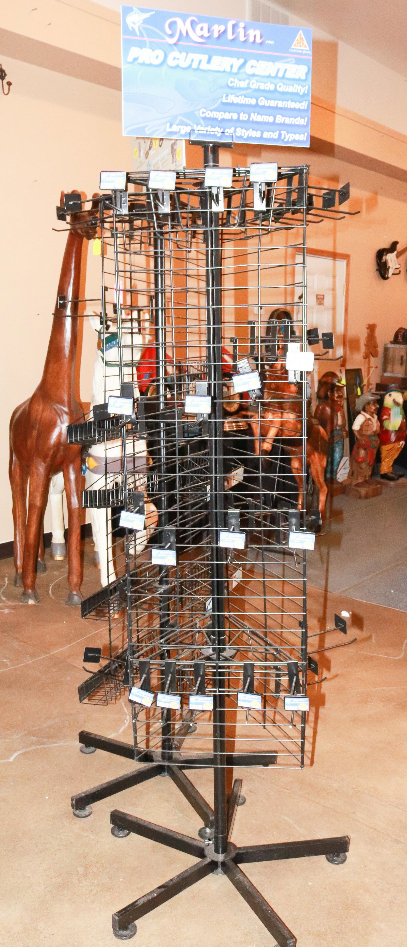 METAL MARLIN STORE DISPLAY RACK: ADJUSTABLE METAL PEGS SIZE: 74" H TERMS: This is an On-Site Auction. Pick-up will be from Monday April 4th – Thursday April 7th from 9:00am till 4:00pm OR BY APPOINTMENT. All Items must be paid 