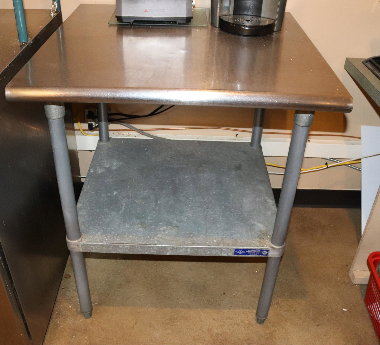 STAINLESS STEEL WORK TABLE: L&J RESTAURANT MANUFACTURER. GALVANIZED SHELF SIZE: 36" X 30" X 30" TERMS: This is an On-Site Auction. Pick-up will be from Monday April 4th – Thursday April 7th from 9:00am till 4:00pm OR BY AP