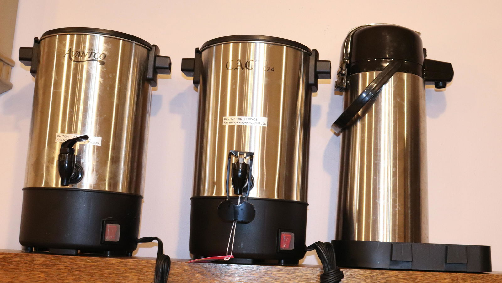 GROUP LOT OF COFFEE MAKERS: TWO ELECTRIC COFFEE MAKERS AND ONE PUMP DISPENSER SIZE: 13 1/2" H TERMS: This is an On-Site Auction. Pick-up will be from Monday April 4th – Thursday April 7th from 9:00am till 4:00pm OR BY APPO