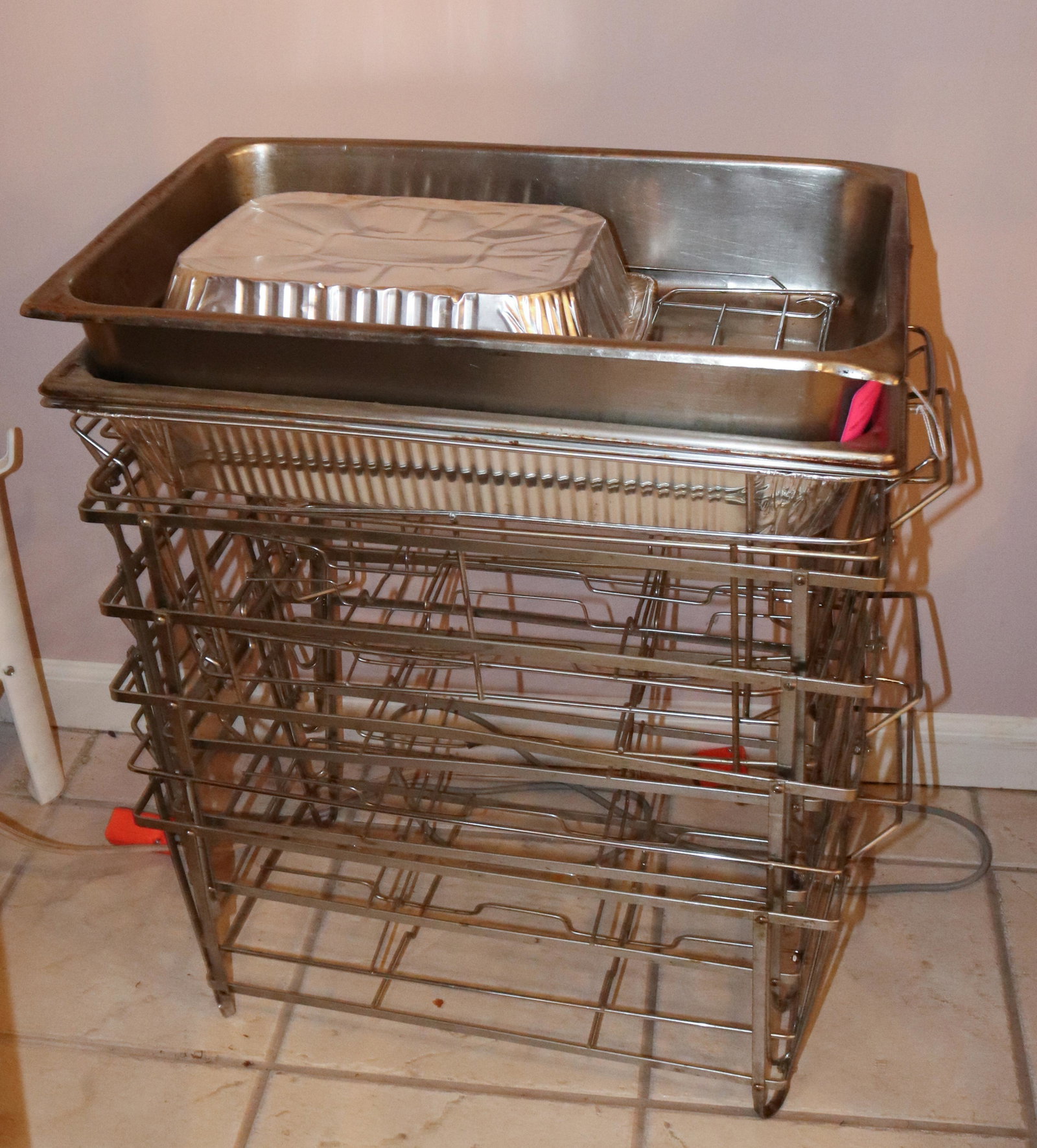 STAINLESS STEEL RESTAURANT TRAYS AND HOLDERS: THREE RECTANGULAR TRAYS AND EIGHT HOLDERS SIZE: TRAYS 20 1/2" X 13" TERMS: This is an On-Site Auction. Pick-up will be from Monday April 4th – Thursday April 7th from 9:00am till 4:00pm OR BY AP