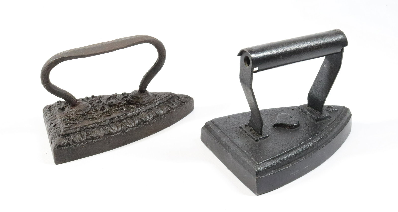 Pr. of Decorated Sad Irons: One with Heart, Other has Decorated Top SIZE: 6"