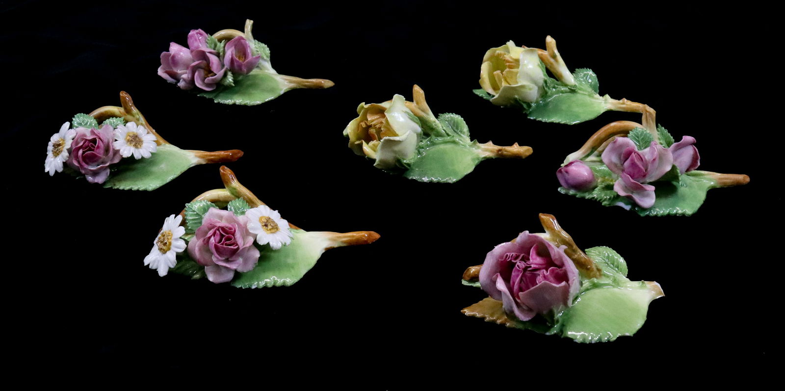 DRESDEN SAXONY PORCELAIN: (7) CARD HOLDERS HANDMADE ROSES WITH ORIGINAL PAPER LABELS DIMENSIONS: 1 1/5" X 3 1/2" TERMS: Hartzell's Auction Gallery will handle most of the shipping in-house. WE do reserve the right to not ship