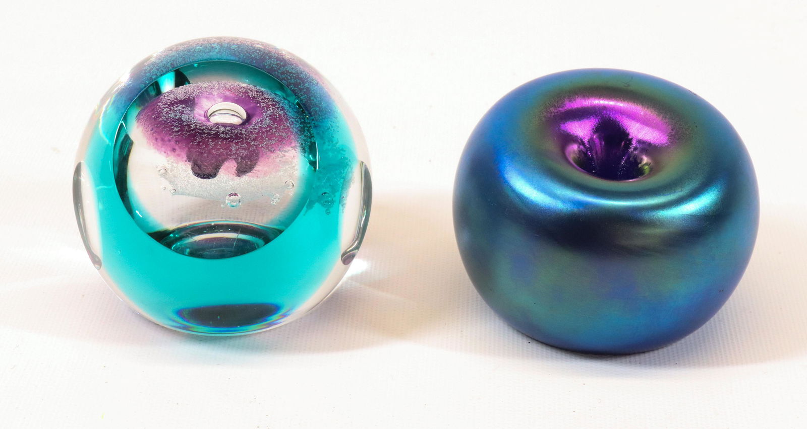 PAPERWEIGHT LOT: ORIENT & FLUME 1984 IRIDESCENT BLUE AND REVELATION CAITHNESS SCOTLAND DIMENSIONS: 2 1/2" X 3 1/4" 3" X 3" TERMS: Hartzell's Auction Gallery will handle most of the shipping in-house. WE do reserve the