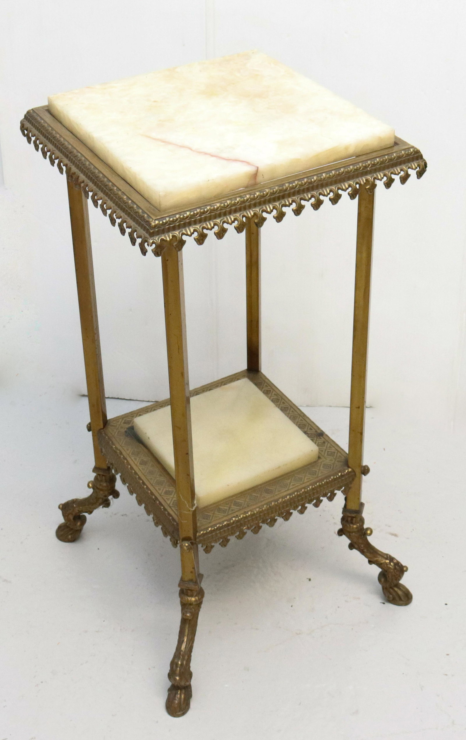 ANTIQUE MARBLE AND BRASS TABLE: HEAVY BRASS AND MARBLE TABLE WITH FANCY PAW FEET DIMENSIONS: 30" X 14" X 14" TERMS: Hartzell's Auction Gallery will handle most of the shipping in-house. WE do reserve the right to not ship some large