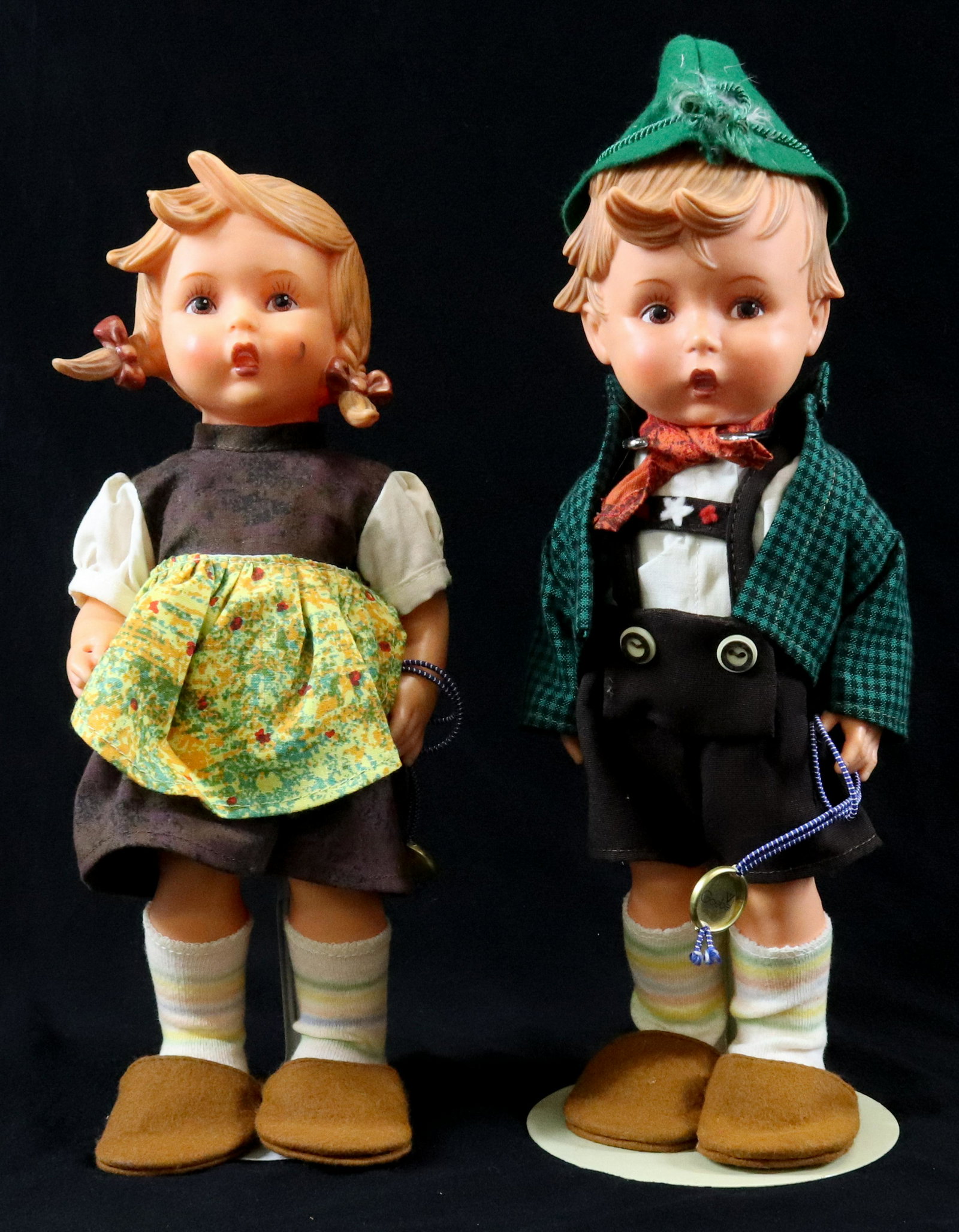 GOEBEL DOLL LOT: (2) BOY AND GIRL DOLLS - PLASTIC WITH AUTHENTIC CLOTHING SIZE: 12" H TERMS: Please Read Carefully. Pick-Up will be 1 WEEK ONLY. June 20th through June 24th. Hartzell’s Auction Gallery will Handl
