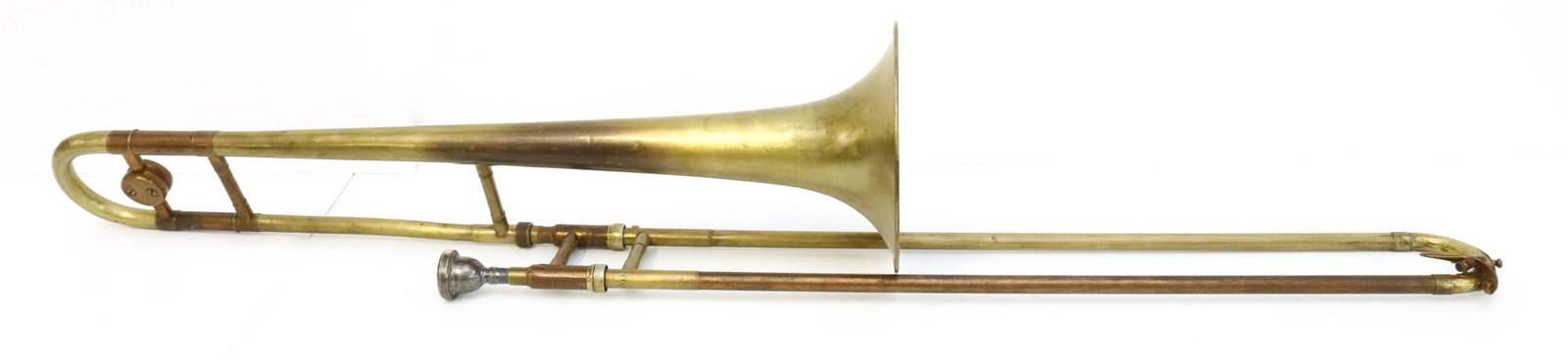 TROMBONE: CLEVELAND SLIDE TROMBONE SIZE: 46" X 7" TERMS: Please Read Carefully. Pick-Up will be 1 WEEK ONLY. June 20th through June 24th. Hartzell’s Auction Gallery will Handle All Shipping In-House. Plea