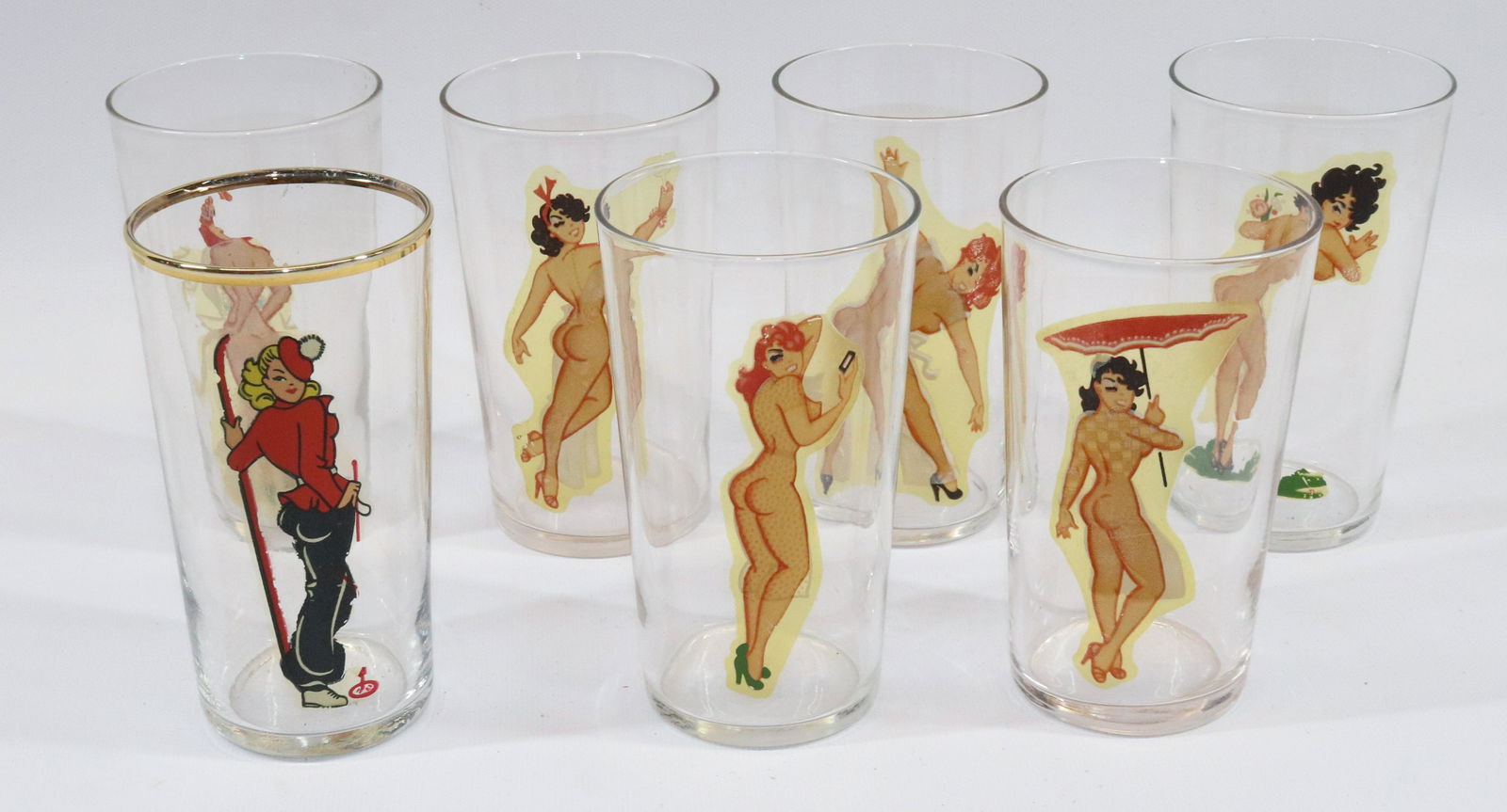 (7) VINTAGE NUDIE GLASSES: SIX FROM SAME SET PLUS ONE GOLD TRIMMED Dimensions: 4 3/4" H Pick-up will be Monday June 27th Through Thursday June 30th. Auto-pay will run 72 Hours after the Auction, If you need shipping please send