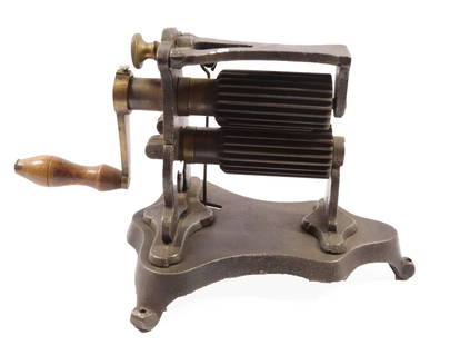 FRENCH FLUTING MACHINE: CAST IRON WITH LIFT-UP ROLLER ON THREE LEGGED BASE. SIMILAR TO THE LENOIR 2 3/4" ROLLER LENGTH