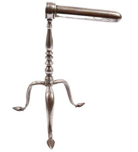 ENGLISH GOFFERING IRON: SINGLE BARREL WITH TURNED POSTS, TRIPOD BASE WITH SPADE FEET. NICKEL PLATED 9 1/2" H WITH 5" BARREL