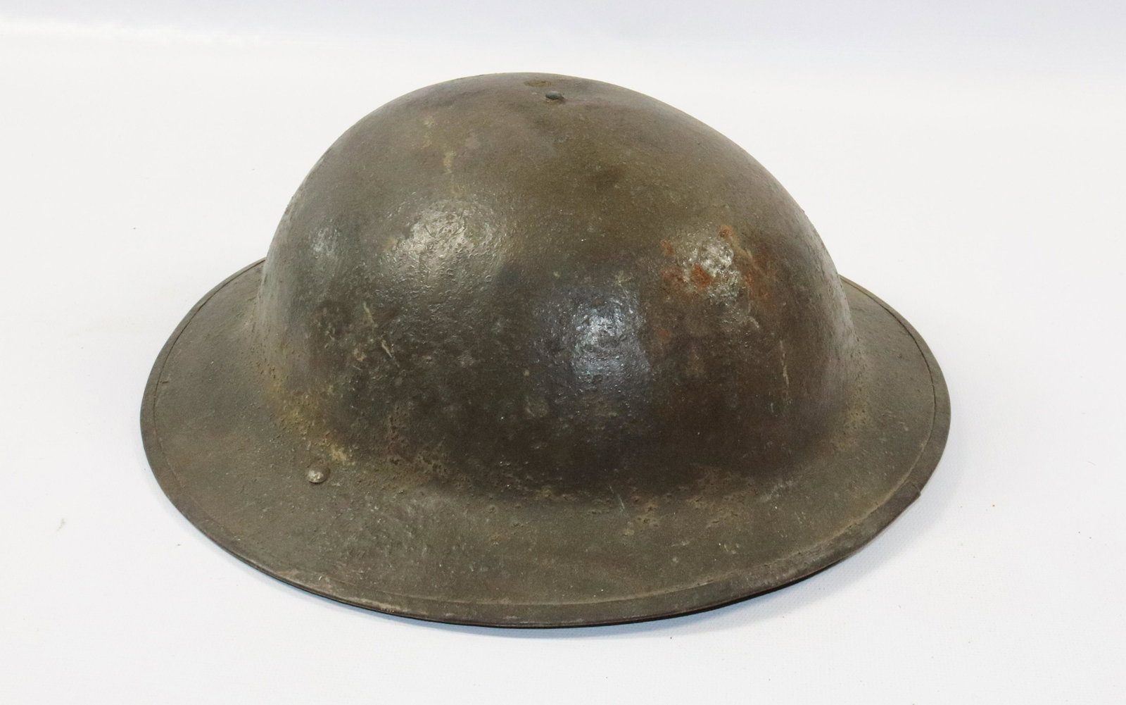WWI MILITARY HELMET: PAINTED METAL DOUGHBOY HELMET WITH LINER Size: 12 1/8" D Terms: PLEASE READ THIS CAREFULLY AND FULLY BEFORE BIDDING - THIS IS AN ON-SITE AND LIVE IN PERSON AUCTION. PREVIEW WILL BE SUNDAY JULY 10TH FR