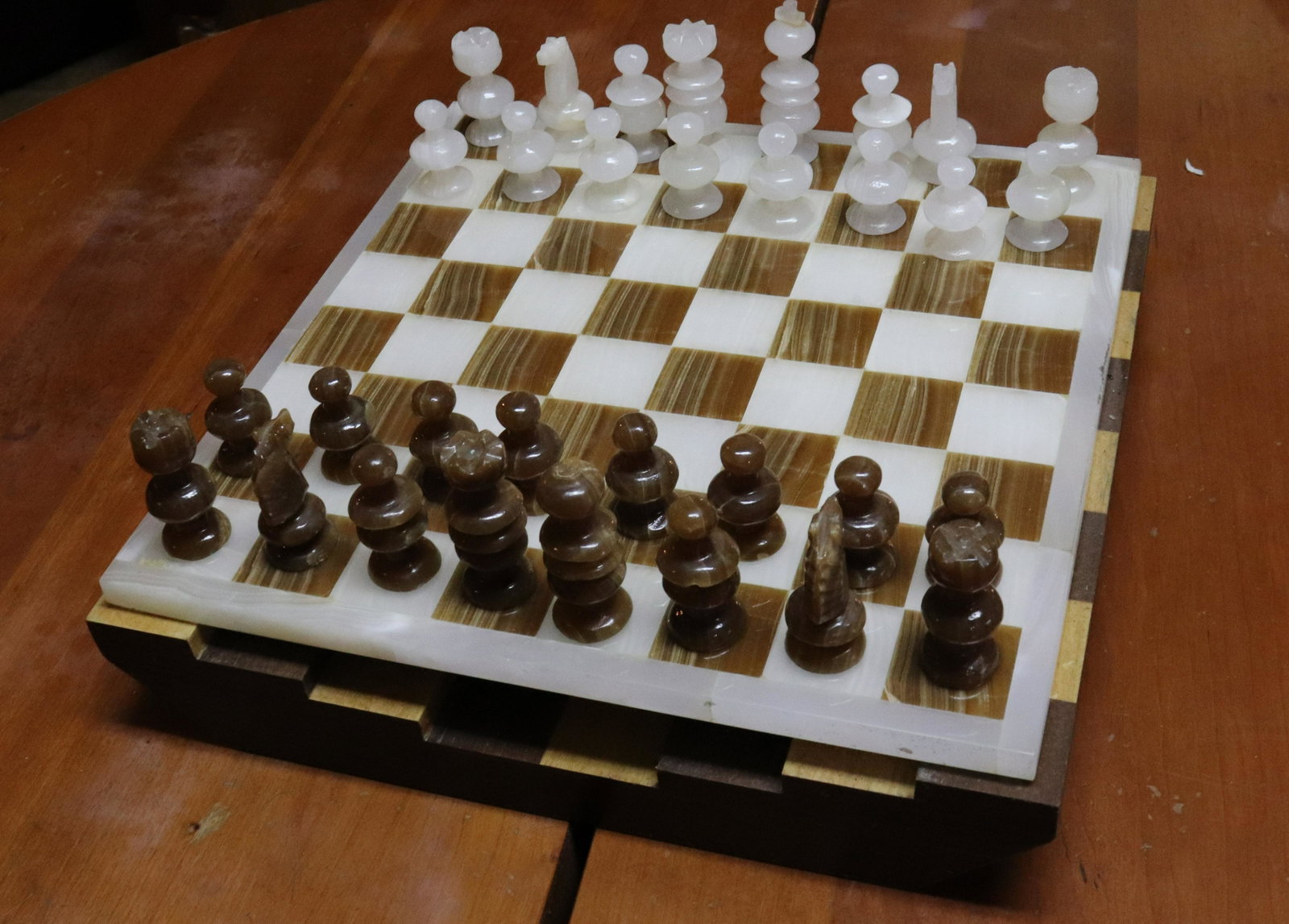 ONYX CHESS SET: CHESS SET WITH 2 BOARDS Size: 13 1/2" x 13 1/2" Terms: PLEASE READ THIS CAREFULLY AND FULLY BEFORE BIDDING - THIS IS AN ON-SITE AND LIVE IN PERSON AUCTION. PREVIEW WILL BE SUNDAY JULY 10TH FROM 10:00A
