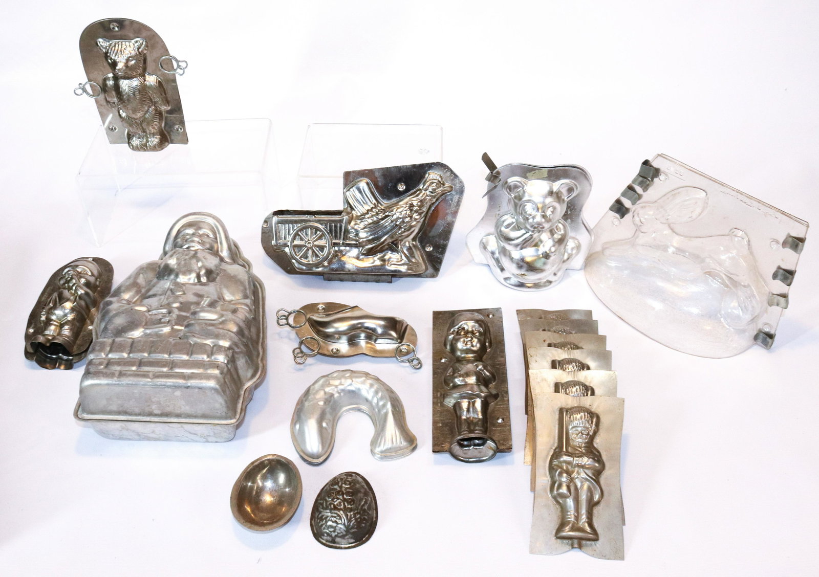 GROUP LOT OF CHOCOLATE MOLDS: (10) MOLDS IN VARIOUS SHAPES AND SIZES. TWO ARE MRKD. HOLLAND LARGEST IS SANTA IN CHIMNEY 10 1/2" L THIS AUCTION WILL ONLY HAVE 1 DAY FOR PICK-UP. PICK-UP WILL BE FRIDAY AUGUST 5TH, 2022 FROM 9:30 TIL