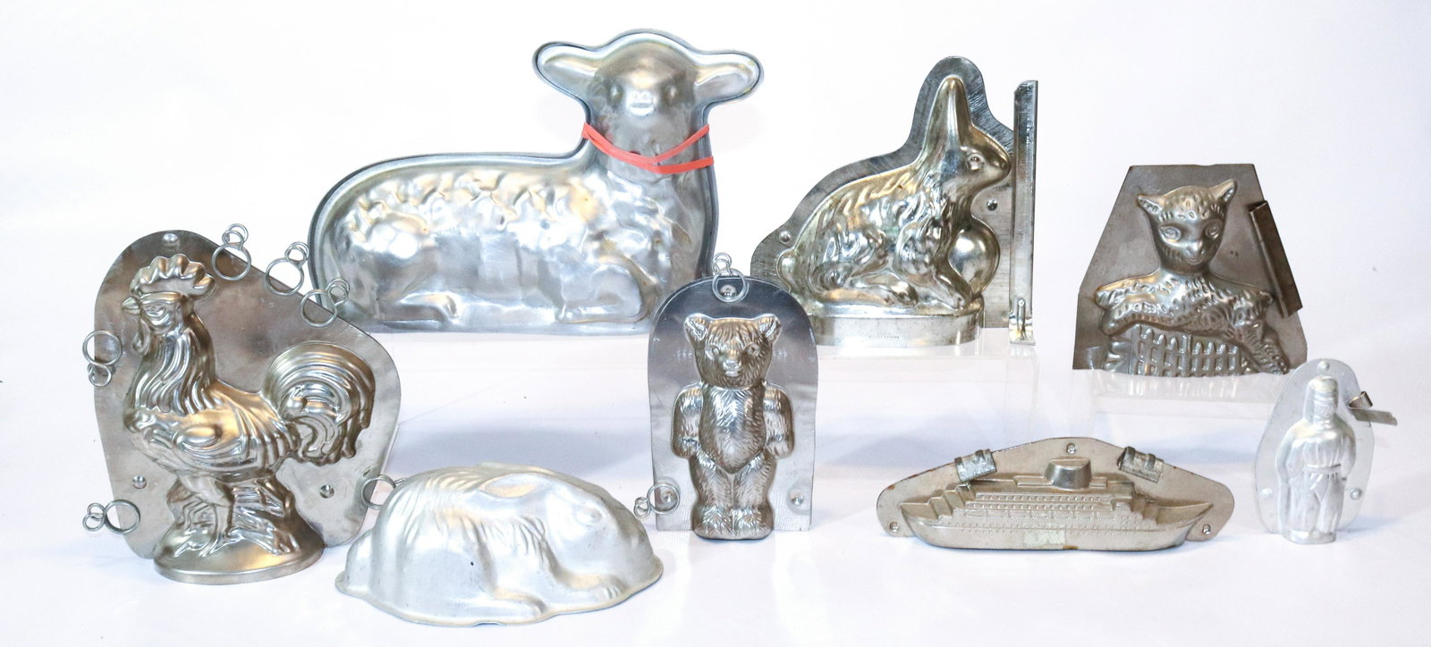 GROUP LOT OF CHOCOLATE MOLDS: VARIOUS SHAPES AND SIZES LARGEST LAMB 10" L THIS AUCTION WILL ONLY HAVE 1 DAY FOR PICK-UP. PICK-UP WILL BE FRIDAY AUGUST 5TH, 2022 FROM 9:30 TILL 3:00PM - ALL PAYMENTS MUST BE MADE THROUGH LIVEAUCTION