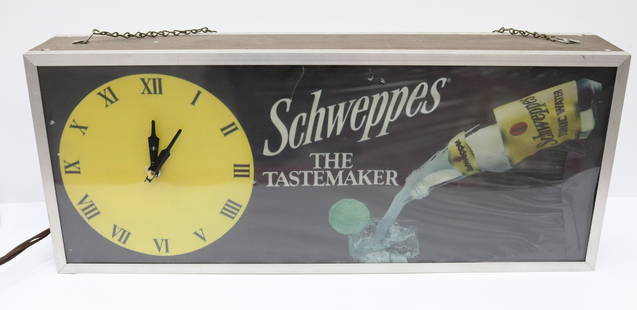 SCHWEPPES ADVERTISING CLOCK: SIGN LIGHTS UP AND CLOCK RUNS. MEASURES 24" X 10" Terms & Conditions: Pick-up for this Auction will be Wednesday August 3rd and Thursday August 4th from 9:00am till 3:30pm and Friday August 5th