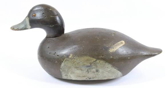 PAINTED WOODEN DUCK DECOY: PAINTED SURFACE WITH GLASS EYES. LEAD WEIGHT ON BOTTOM. MEASURES 13 1/2" L. Terms & Conditions: Pick-up for this Auction will be Wednesday August 3rd and Thursday August 4th from 9:00am till 3:30pm an