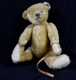 VINTAGE STEIFF TEDDY BEAR: JOINTED BODY. MISSING ONE GLASS EYE. FELT PADS ON PAWS/FEET. PARTIAL STRAP ON ONE ARM. NO BUTTON IN EAR. MEASURES 12 1/2" L. Terms & Conditions: Pick-up for this Auction will be Wednesday August 3rd a