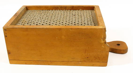 WOODEN BOX GRATER: LARGE WOODEN GRATER WITH PUNCHED SURFACE. SLIDE-OUT DRAWER UNDER. MEASURES 12" L Terms & Conditions: Pick-up for this Auction will be Wednesday August 3rd and Thursday August 4th from 9:00am till 3:30