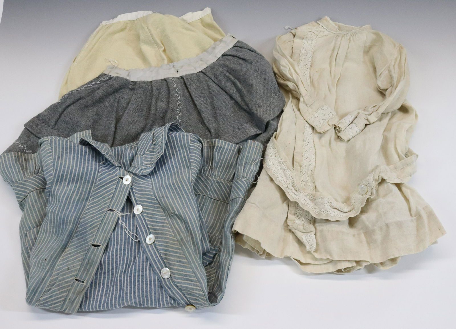 LOT OF VINTAGE CLOTHING: COTTON WHITE WEAR, WOOL, CHILDRENS DRESSES AND MORE. BLUE/WHITE STRIPED MEASURES 23" L Terms & Conditions: Pick-up for this Auction will be Wednesday August 3rd and Thursday August 4th from 9:00am til