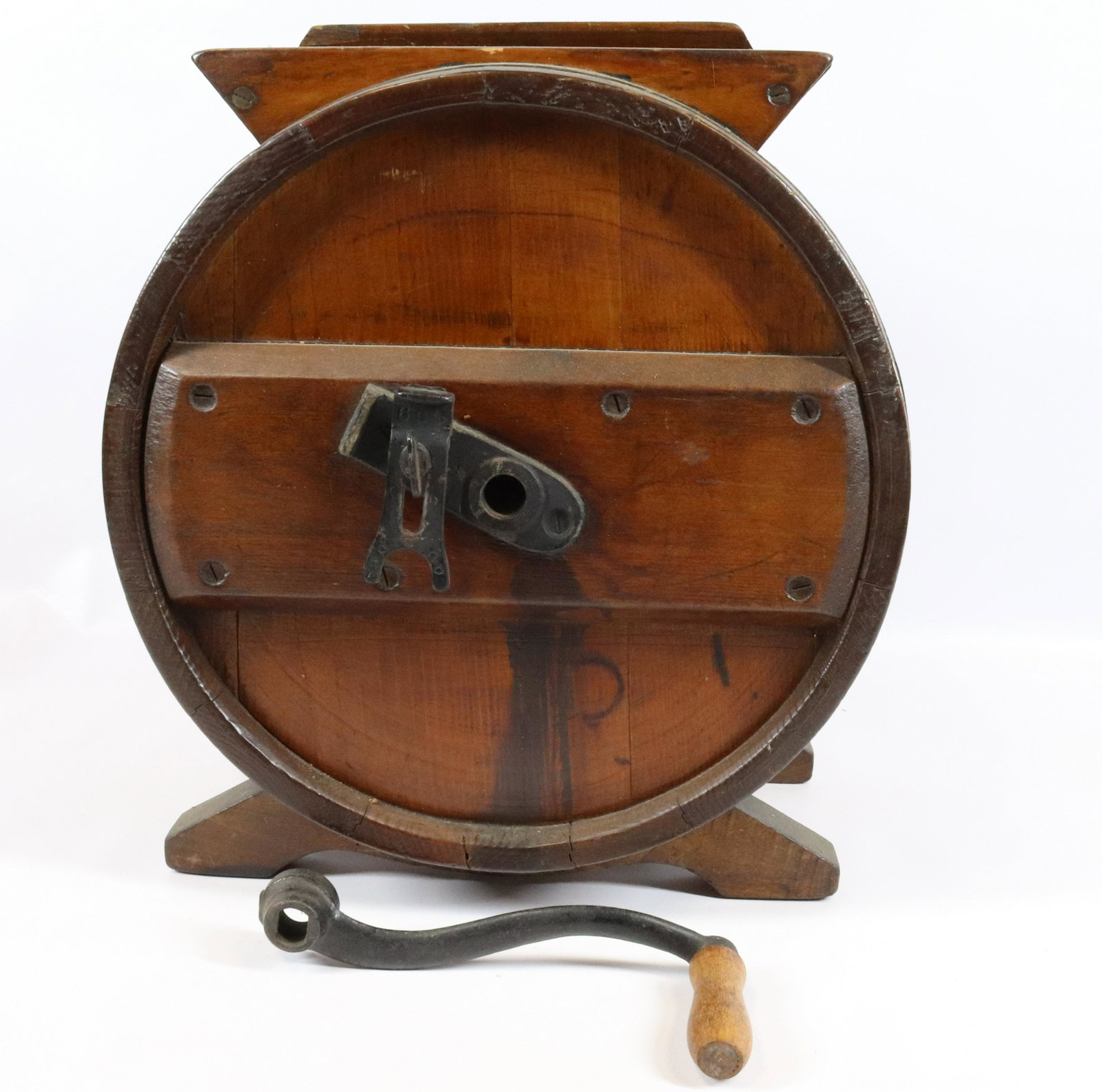WOODEN BUTTER CHURN: TABLETOP STYLE WITH IRON BANDS AND CRANK. MISSING ATTACHMENT POINT FOR HANDLE. MEASURES 14 1/2" X 13".