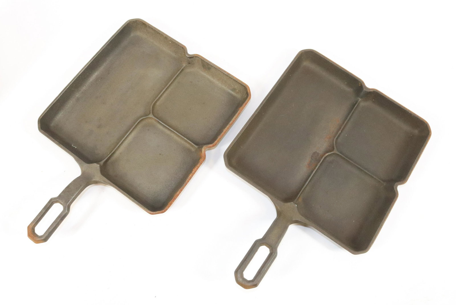 (2) GRISWOLD CAST IRON BREAKFAST SKILLETS: COLONIAL BREAKFAST SKILLETS #666. MEASURES 13 1/2" X 9".