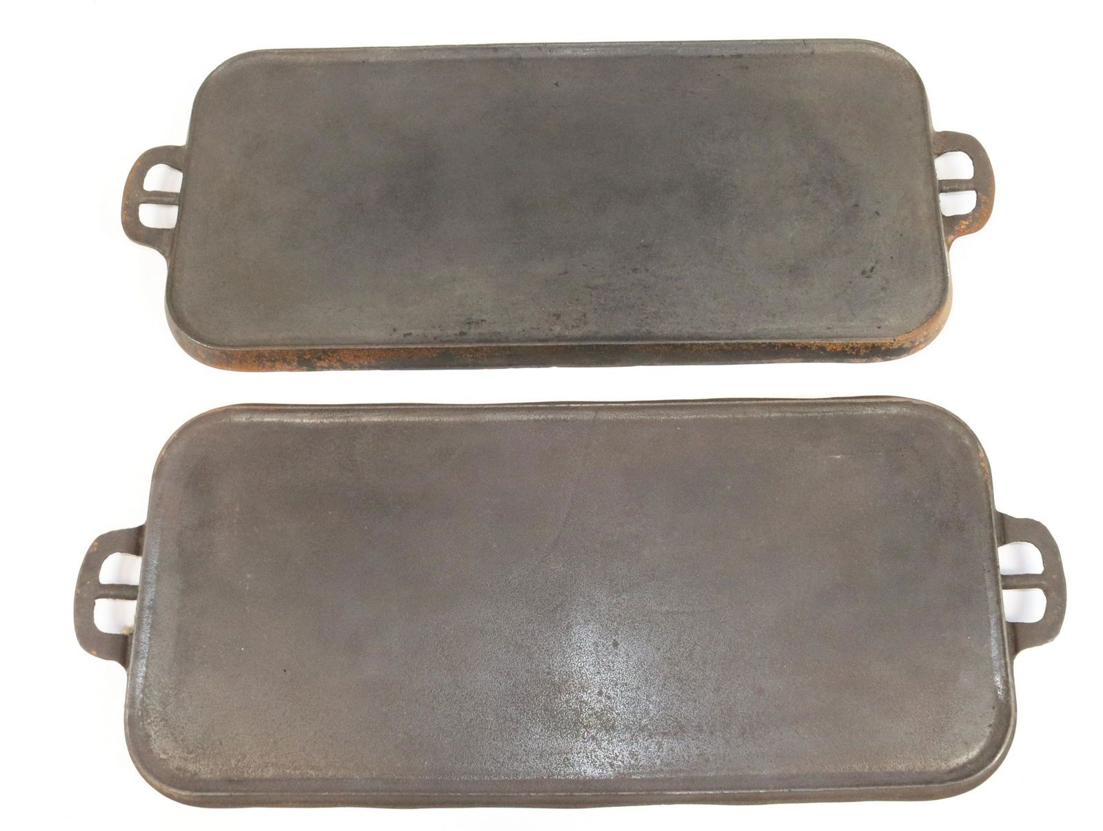 (2) VINTAGE CAST IRON GRIDDLES: ERIE #8 (745A) AND WAPACK #8 (FAINT ERIE MARK). MEASURE 21 3/4" AND 22" L.