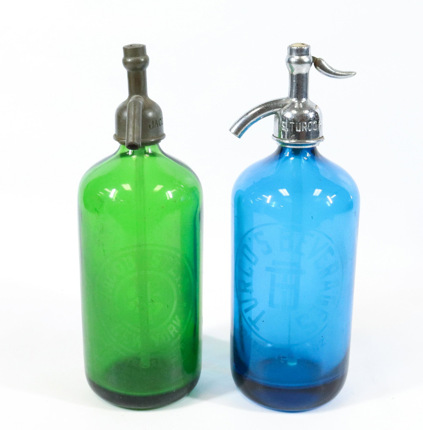GREEN AND BLUE ADVERTISING SELTZER BOTTLES: GREEN MRKD. JACOB STEIN (NEW YORK) AND BLUE MRKD. TURCO'S BEVERAGES. MEASURE 11" H