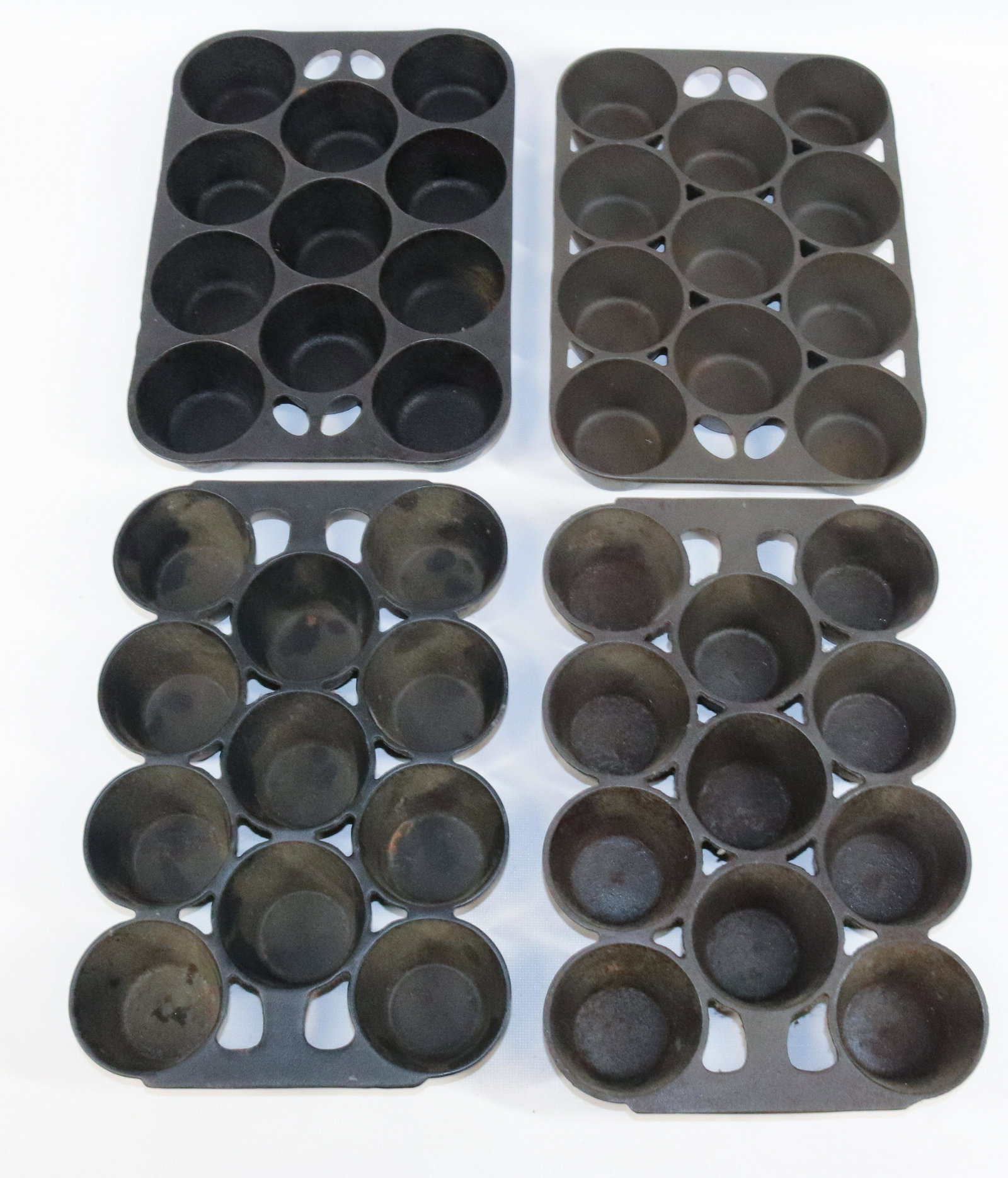 LOT OF GRISWOLD AND ERIE CAST IRON PANS: INCLUDING: GRISWOLD WAGNER WARE, GRISWOLD NO. 10 (949) AND TWO ERIE NO. 10 (948). MEASURE 11" X 7 3/4".