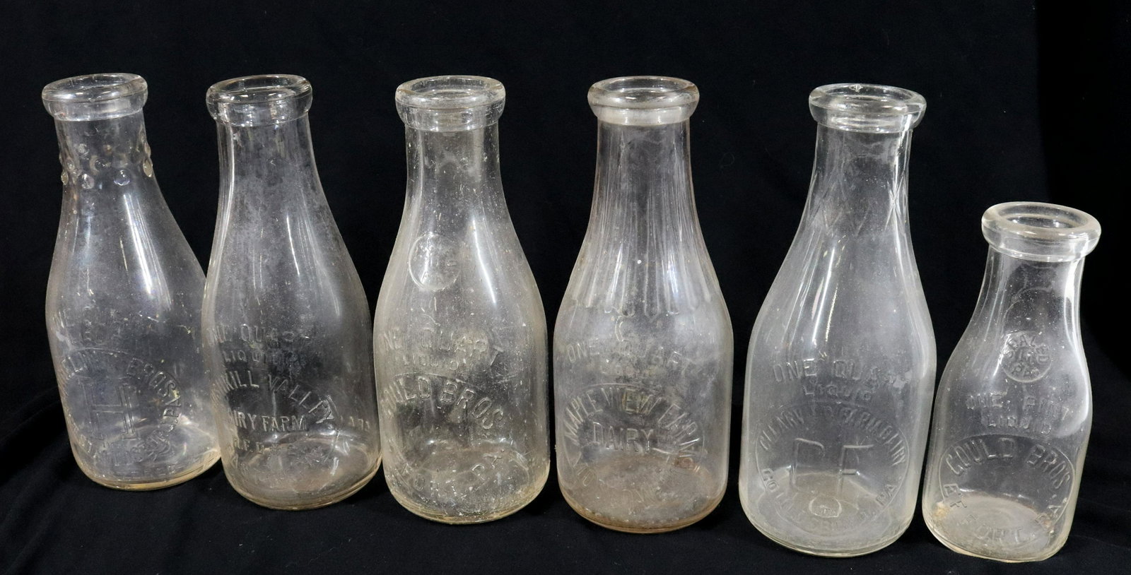 LOT OF PENNSYLVANIA GLASS MILK BOTTLES: INCLUDING: TWO GOULD BROS. (EFFORT), MAPLE VIEW (MOSCOW), CLEARVIEW FARM (GOULDSBORO), HINELINE BROS. (EAST STROUDSBURG) AND BUSHKILL VALLEY (EASTON). MEASURE 7" TO 9 1/2" H