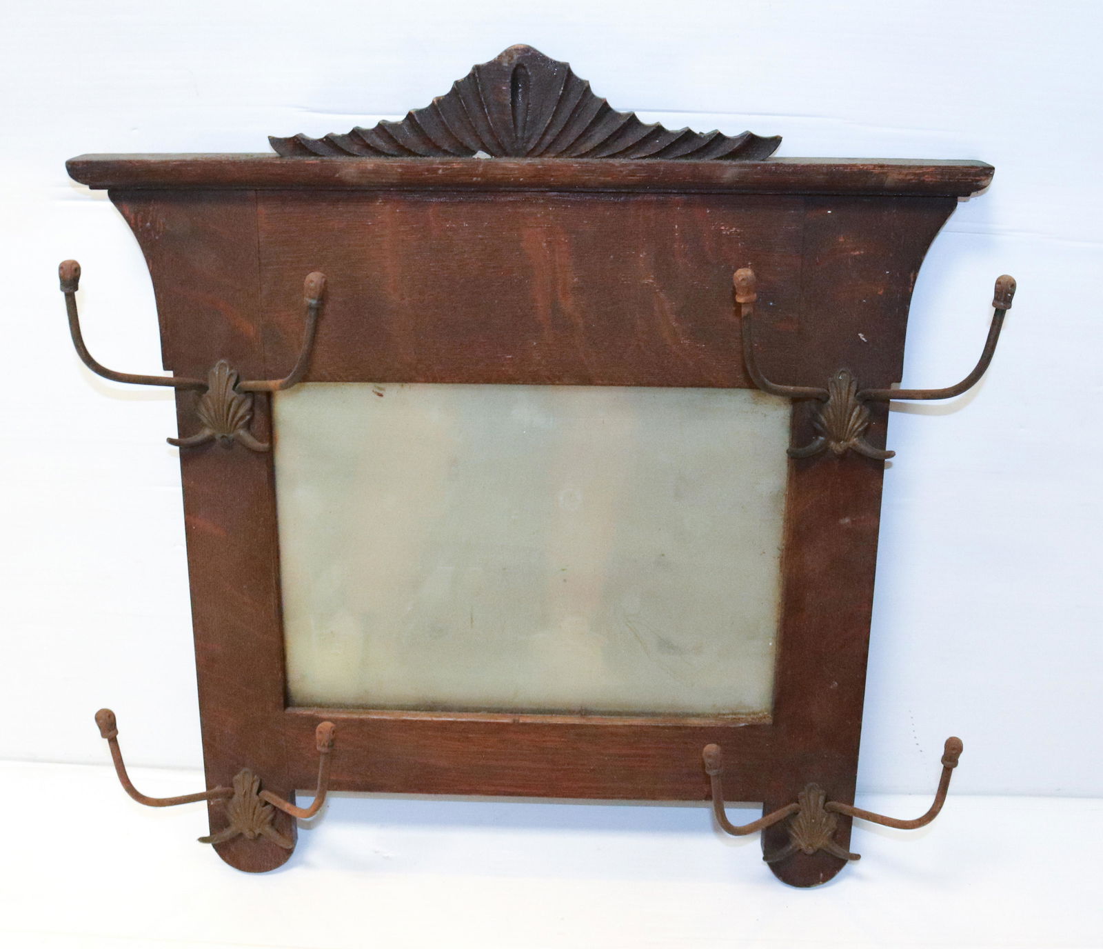 OAK HAT RACK: MIRRORED BACK WITH HOOKS ON EITHER SIDE. MEASURES 23 1/2" X 22 1/2"