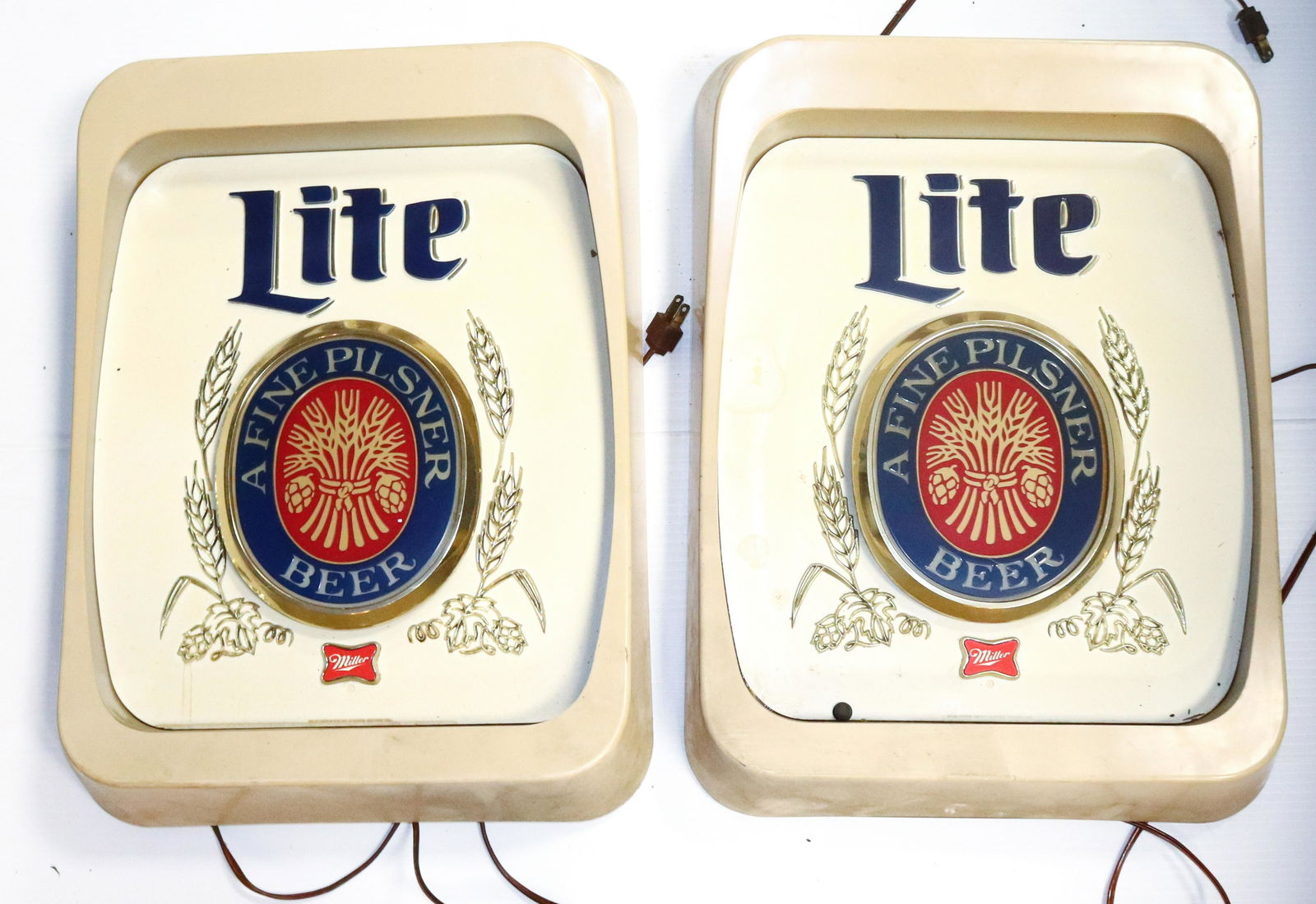 (2) MILLER BREWING COMPANY LIGHT-UP SIGNS: MOLDED PLASTIC MILLER LITE. MEASURE 17" X 14"