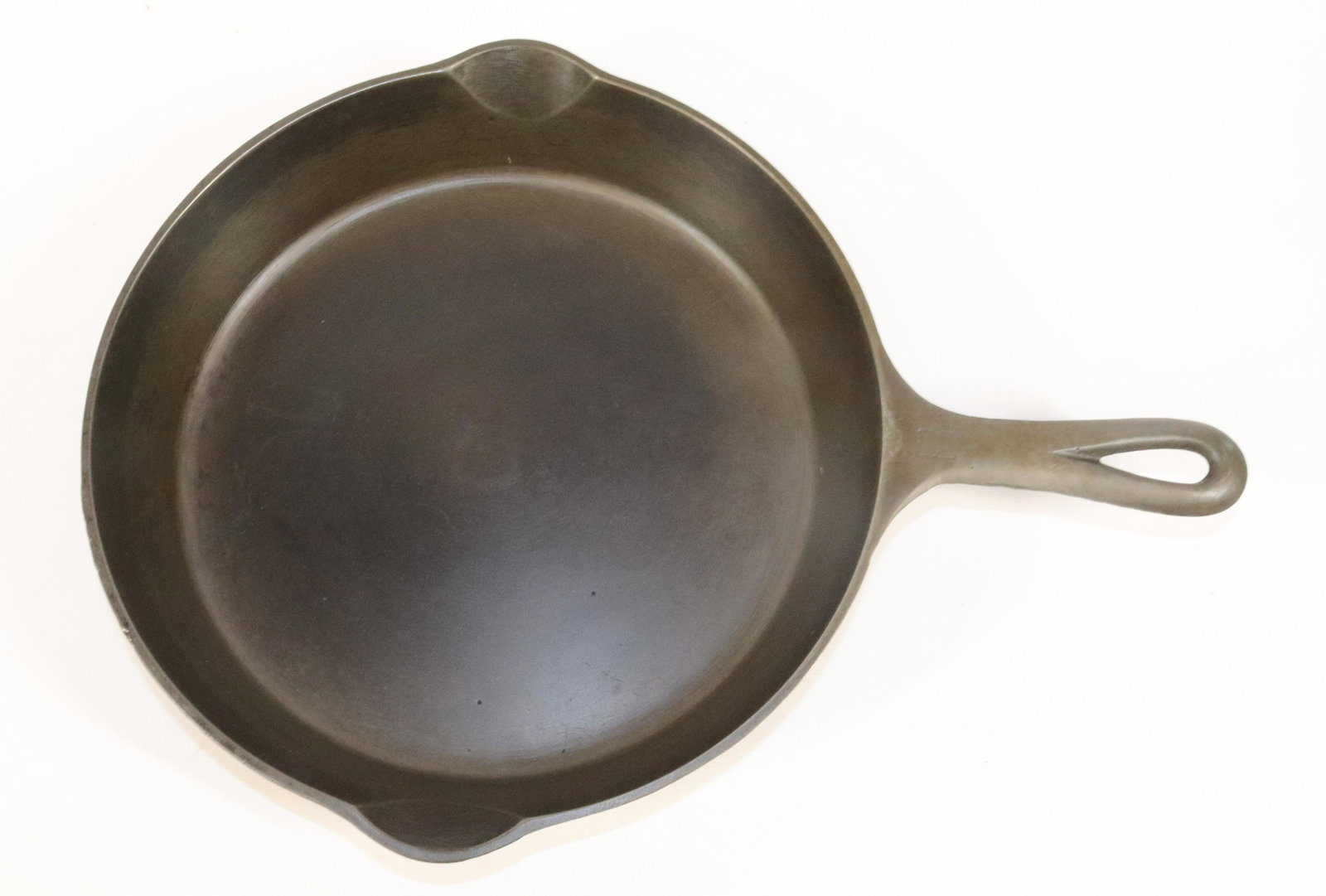 GRISWOLD CAST IRON SKILLET: MRKD. #8 (704Z). MEASURES 15 1/4" TOTAL LENGTH.