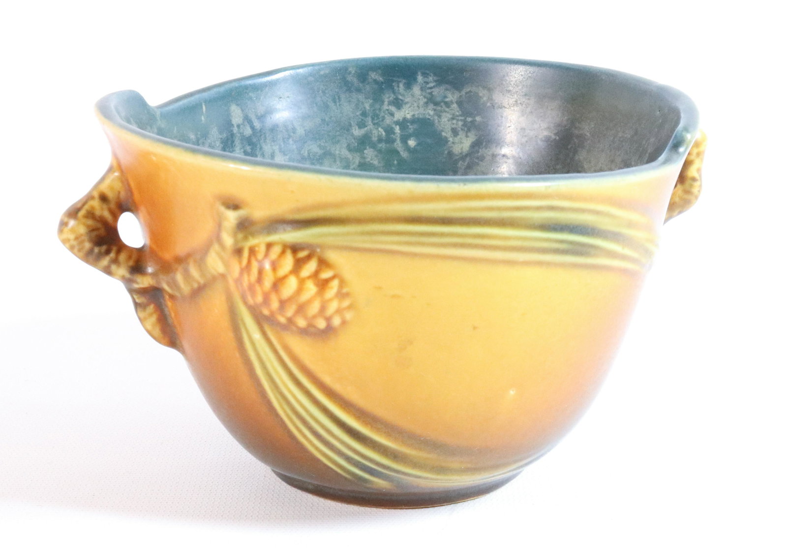 ROSEVILLE PINECONE FLOWER POT: MRKD. ON BOTTOM "ROSEVILLE, 320-5". MEASURES 3 1/2" X 7". Terms: THIS IS AN ON-SITE ONLINE ONLY AUCTION. THE SALE ADDRESS IS 718 STOKES MILL RD. EAST STROUDSBURG, PA 18302. THIS IS THE ESTATE OF CANDA