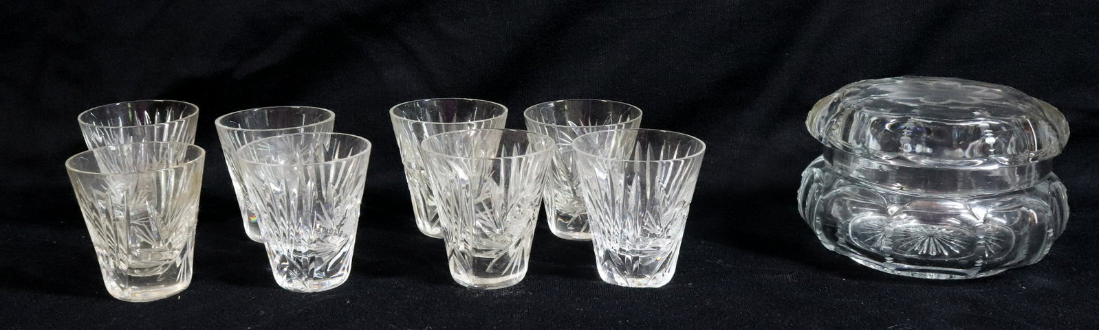 GLASS COVERED DRESSER JAR AND SHOT GLASSES: LIDDED JAR WITH FLOWER ON LID. EIGHT CUT-GLASS MATCHING SHOT GLASSES. JAR MEASURES 5" D. Terms: THIS IS AN ON-SITE ONLINE ONLY AUCTION. THE SALE ADDRESS IS 718 STOKES MILL RD. EAST STROUDSBURG, PA 183