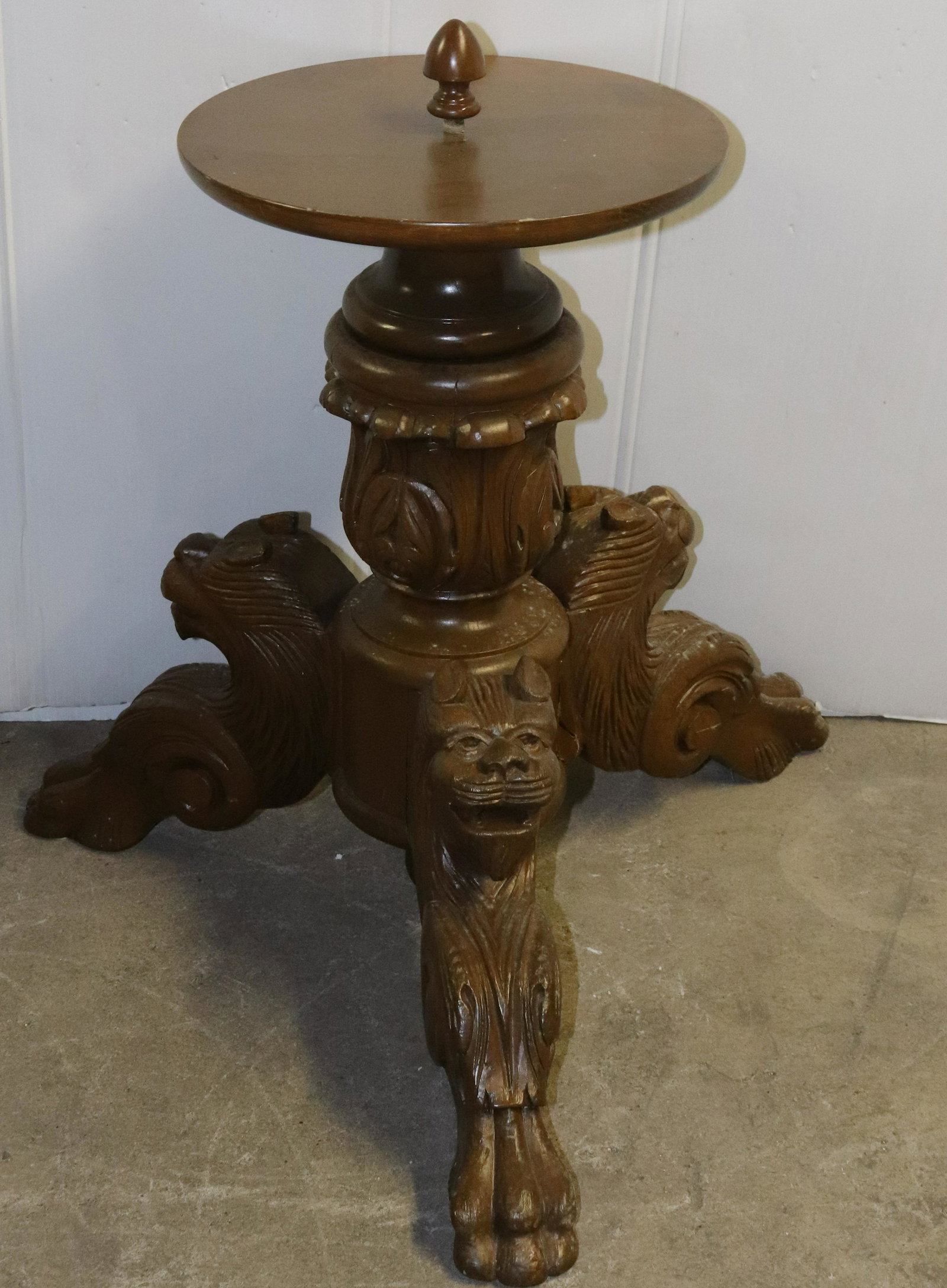 CARVED WOODEN STAND: THREE ANIMAL CARVED LEGS WITH SMALL ROUND TOP. CENTER FINIAL. MEASURES 22" X 12 1/2". Terms: THIS IS AN ON-SITE ONLINE ONLY AUCTION. THE SALE ADDRESS IS 718 STOKES MILL RD. EAST STROUDSBURG, PA 18302.