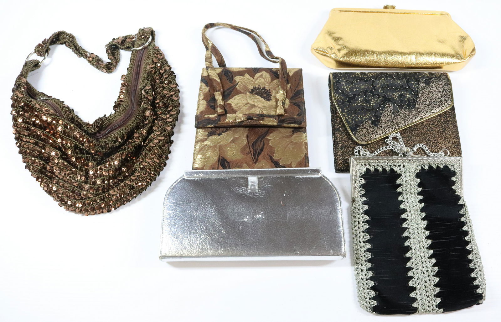 PURSE GROUPING: INCLUDES SIX GOLD SILVER MULTI COLORED LAME SEQUINS PURSE SILVER CROCHET PURSE 5" X 11" Terms: THIS IS AN ON-SITE ONLINE ONLY AUCTION. THE SALE ADDRESS IS 718 STOKES MILL RD. EAST STROUDSBURG, PA 1830
