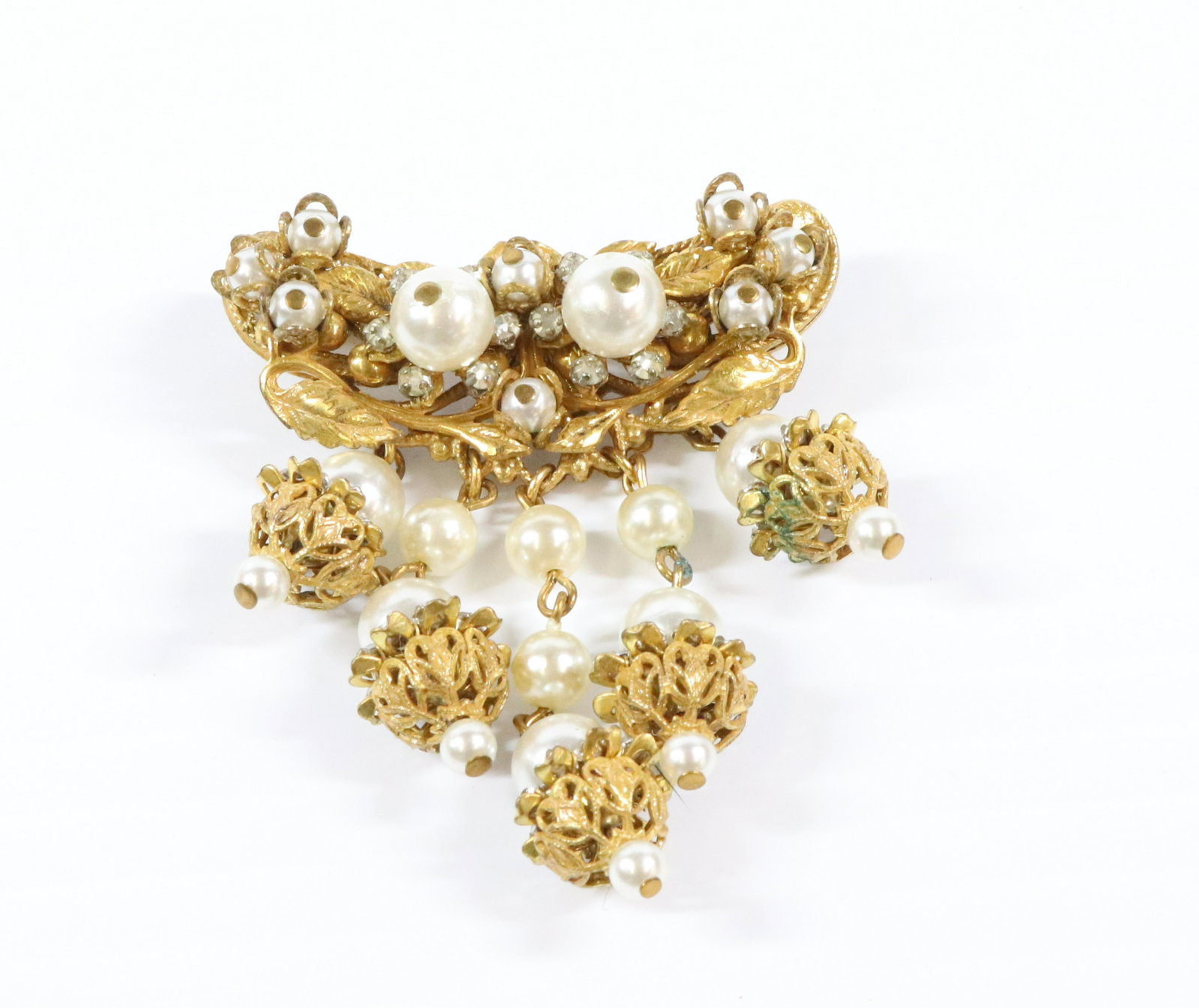 STANLEY HAGLER BROOCH: WITH FIVE DROPS OF PEARLS STANLEY HAGLER TAB ON REVERSE THIS COLLECTION IS FROM 1960S THRU THE 80S 2 1/4"H X 2" Terms: THIS IS AN ON-SITE ONLINE ONLY AUCTION. THE SALE ADDRESS IS 718 STOKES MILL RD. E