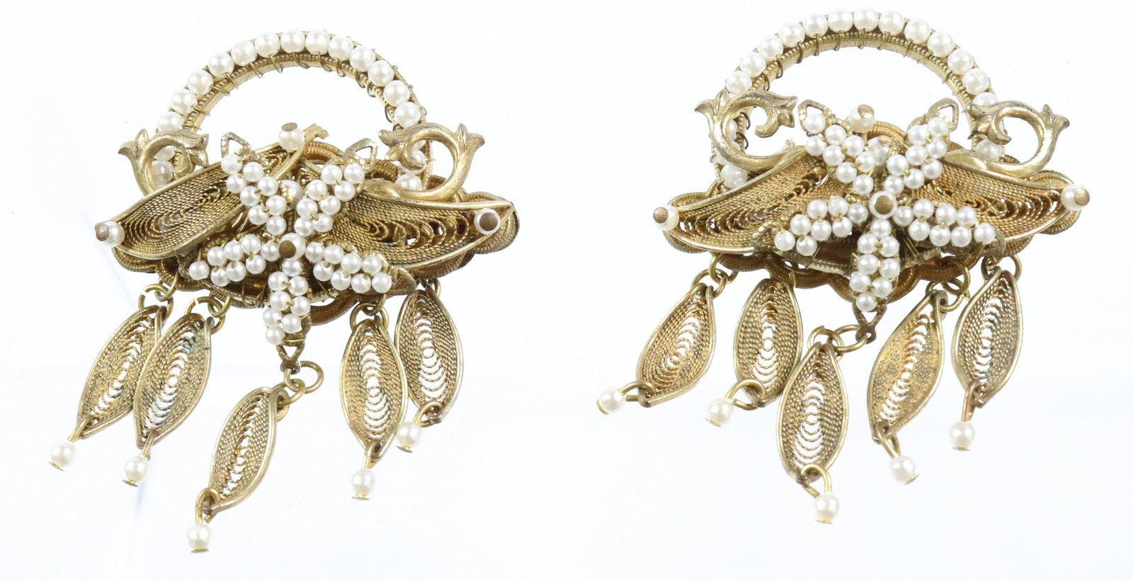 STANLEY HAGLER PAIR BROOCHES: STAR DESIGN IN PEARLS WITH FIVE DROPS EACH WIRED CONSTRUCTION 2 1/2"H X 2" UNMARKED Terms: THIS IS AN ON-SITE ONLINE ONLY AUCTION. THE SALE ADDRESS IS 718 STOKES MILL RD. EAST STROUDSBURG, PA 18302. T