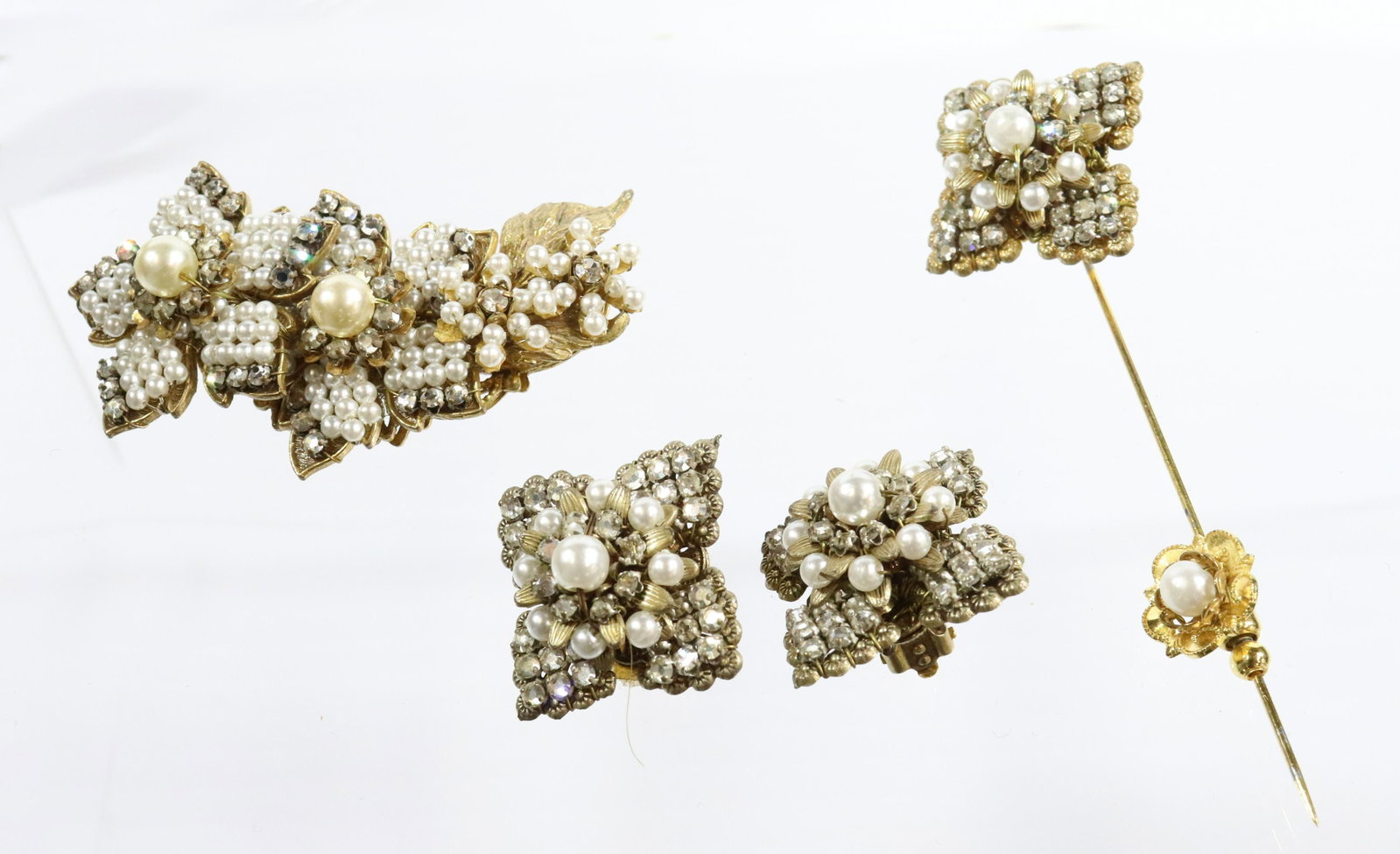 STANLEY HAGLER SUITE: INCLUDES BROOCH STICK PIN AND EARRINGS CRYSTALS AND PEARLS WIRED CONSTRUCTION 1 1/4" X 2 1/2" 1" X 3 1/2" 1 1/4" DIAMETER UNMARKED Terms: THIS IS AN ON-SITE ONLINE ONLY AUCTION. THE SALE ADDRESS IS 71