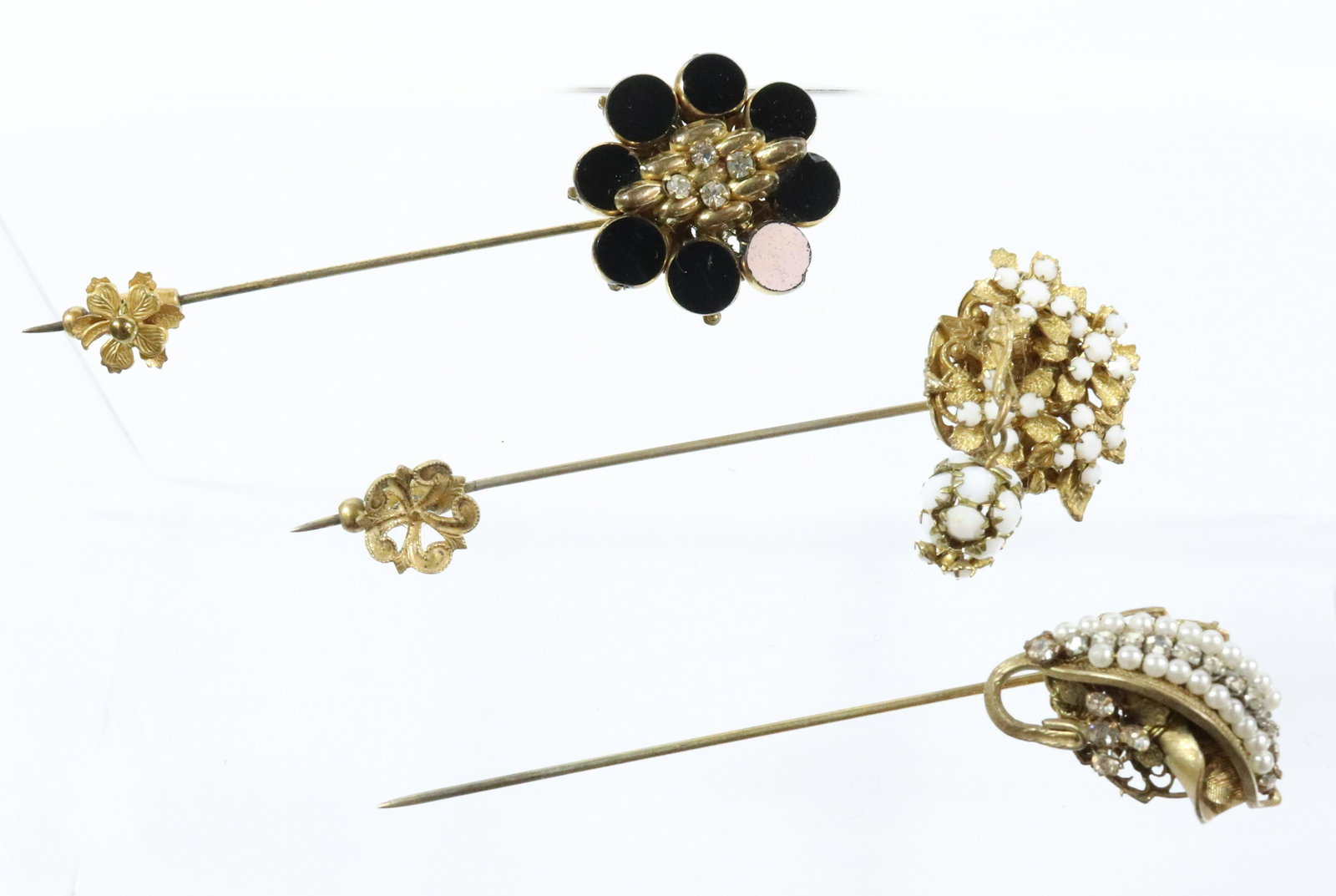 STANLEY HAGLER STICK PINS: (3) BLACK AND CRYSTALS WHITE CRYSTALS PEARLS AND CRYSTALS 1" X 3 1/4"L UNMARKED Terms: THIS IS AN ON-SITE ONLINE ONLY AUCTION. THE SALE ADDRESS IS 718 STOKES MILL RD. EAST STROUDSBURG, PA 18302. THIS 
