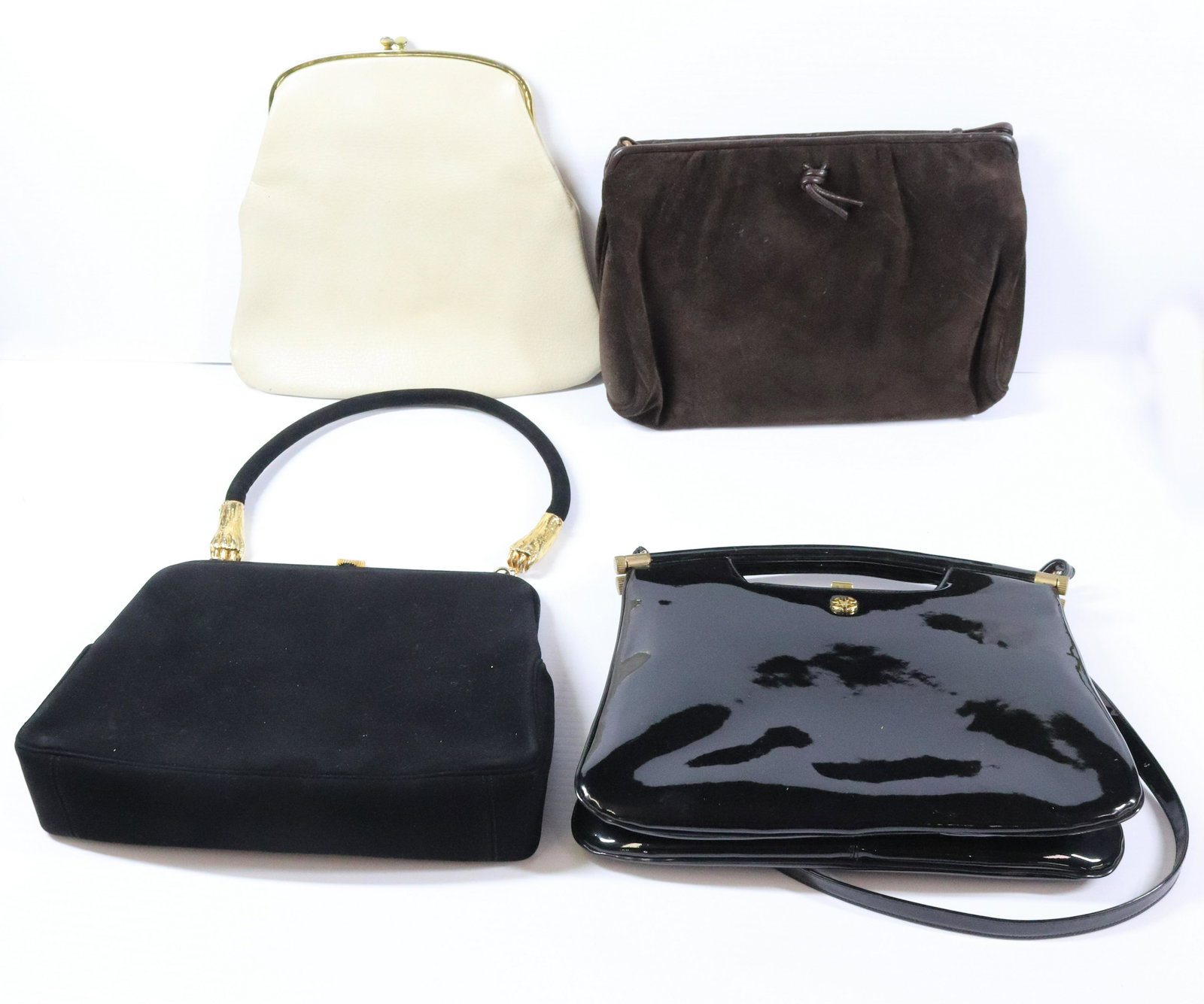 PURSE GROUPING: INCLUDES (4) BIENEN-DAVIS LEATHER PURSE KORET WITH MONKEY CLAW ENDS TO HANDLE MORRIS MOSKOWITZ AND TWO MORE 8 1/2" X 11 Terms: THIS IS AN ON-SITE ONLINE ONLY AUCTION. THE SALE ADDRESS IS 718 STOKES MI