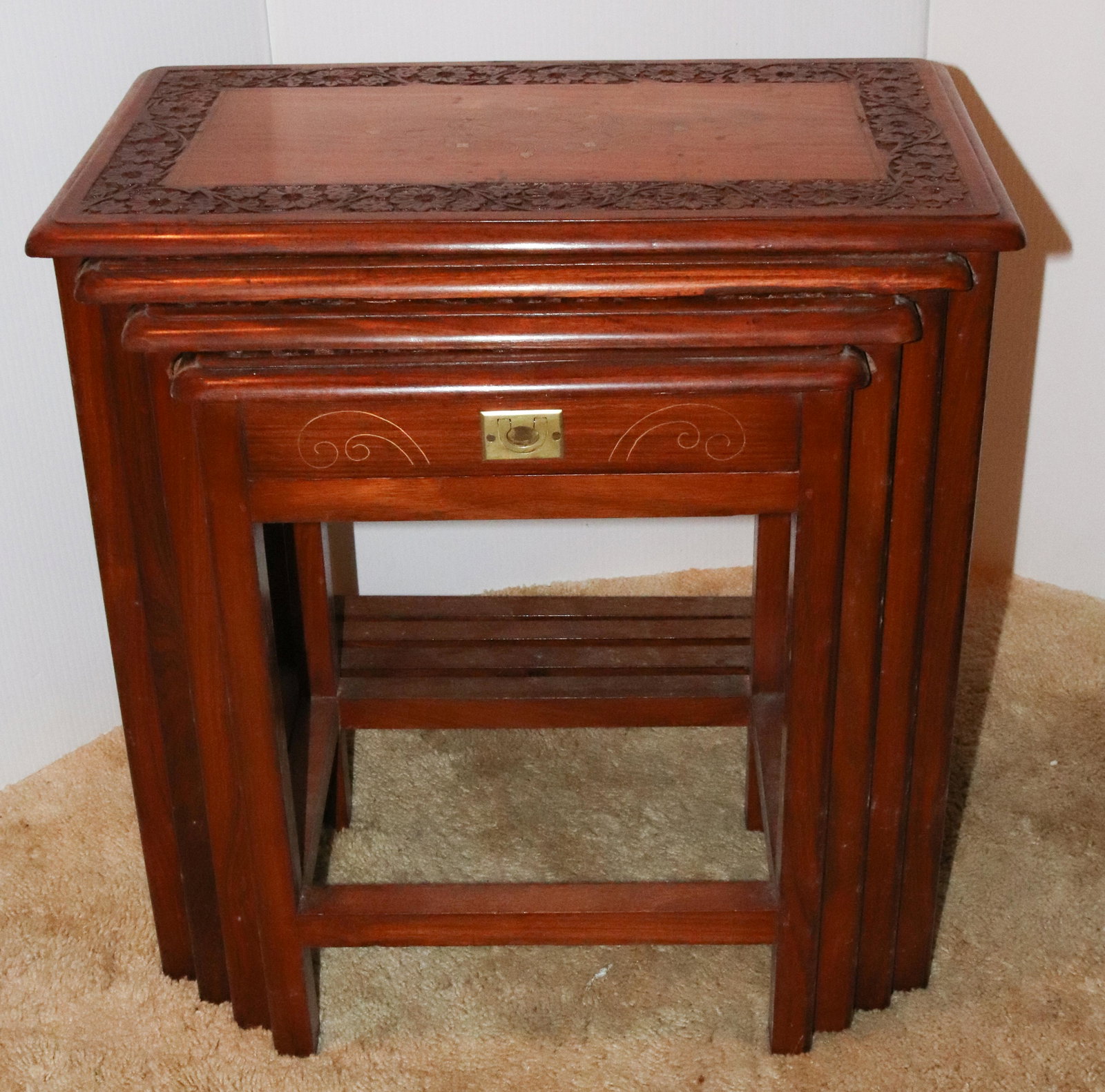 STACK TABLES: FOUR NEST OF CARVED TABLES TERMS: THIS IS AN ON-SITE ONLINE ONLY AUCTION. THE SALE ADDRESS IS 718 STOKES MILL RD. EAST STROUDSBURG, PA 18302. THIS IS THE ESTATE OF CANDACE BRIGGS. THERE WILL BE 2 PART